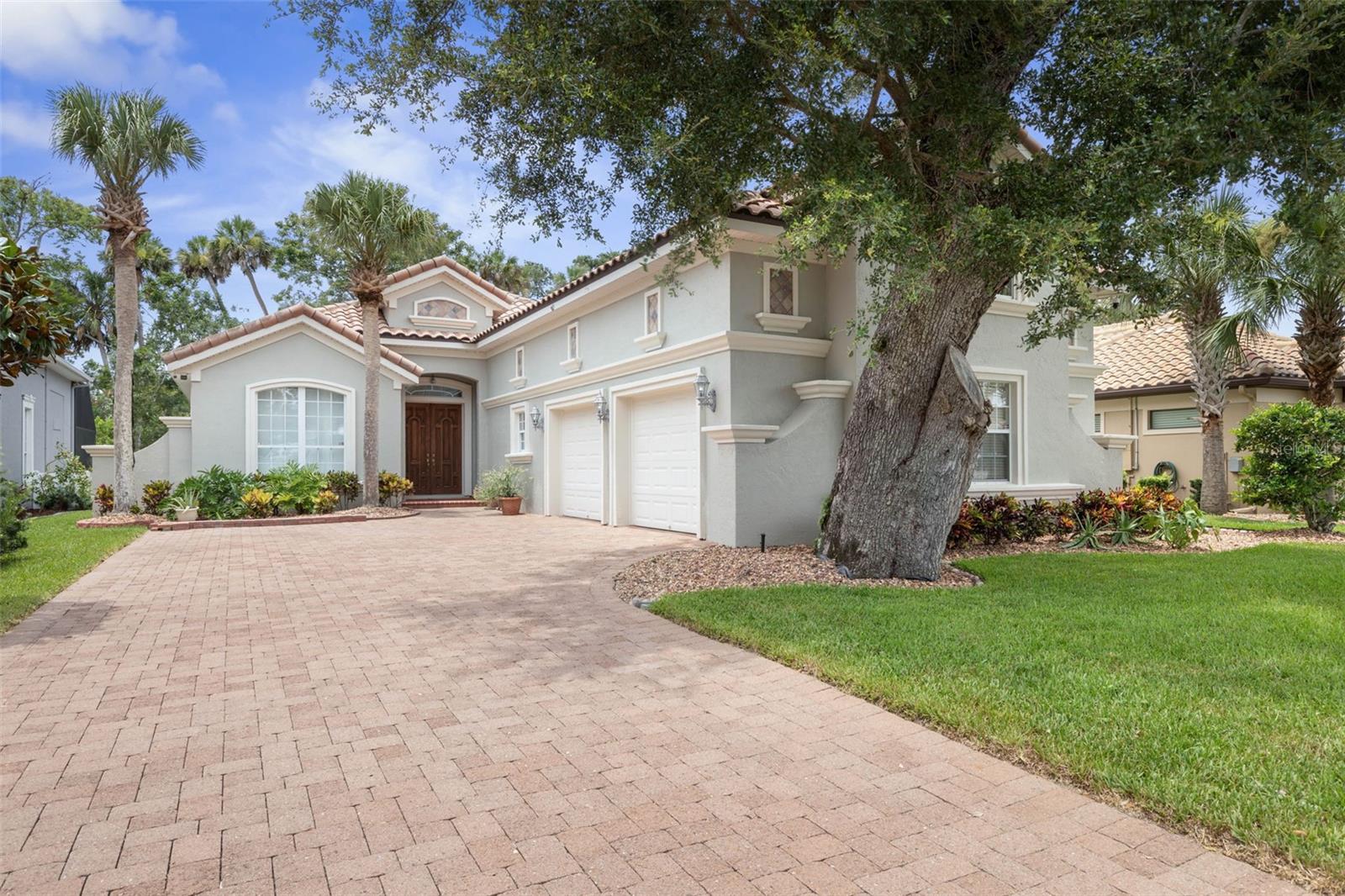 Discover this meticulously maintained, fully furnished custom home by Grandeur Homes, nestled in the prestigious Riverwalk section of Palm Coast Plantation. Light-filled and loaded with upgrades, this residence offers a rare blend of elegance, privacy, and modern comfort.
Inside, enjoy thoughtful finishes including rounded drywall corners, 8’ interior doors, propane cooktop and fireplace, intricate tray ceilings with crown molding, decorative archways and niches, and transom windows above the kitchen backsplash. The open layout and attention to detail create a welcoming, sophisticated atmosphere throughout.
A state-of-the-art camera system ensures ultimate security and peace of mind, while smart design and quality craftsmanship are evident in every corner.
The exterior is equally impressive: a paver driveway, brand-new landscaping with upgraded sprinkler system, tile roof, and an exceptional outdoor entertainment space. The private, walled-in courtyard features an outdoor kitchen, new screen enclosure, and decorative lighting system. The backyard, which backs to tranquil conservation land, includes a custom entertainment area the current owner is transforming into a simulated golf retreat.
Offering 4 spacious bedrooms and 3 full bathrooms, this home is ideal for both everyday living and entertaining guests in style.
Palm Coast Plantation offers the comfort of a gated community with exceptional amenities: a clubhouse, resort-style pool, fitness center, tennis and pickleball courts, basketball, bocce ball, shuffleboard, a 128-acre lake (Emerald Lake) with pier and gazebo, plus boat and RV storage.
Conveniently located near shopping, dining, medical facilities, and the I-95 corridor—yet only minutes from the beaches of the Atlantic Ocean—this is the perfect Florida lifestyle retreat.