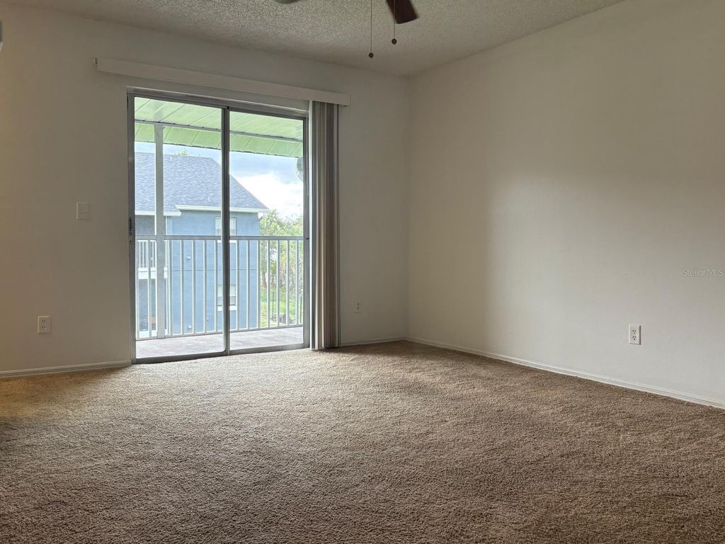 Photo of 4148 Pershing Pointe Place #7, Orlando, FL 32822 (MLS # S5137054)
