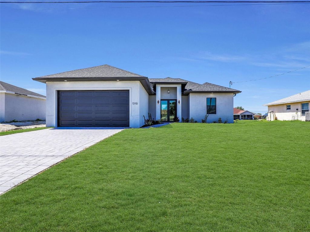 Photo of 1310 NW 11th Terrace, Cape Coral, FL 33993 (MLS # A4690878)