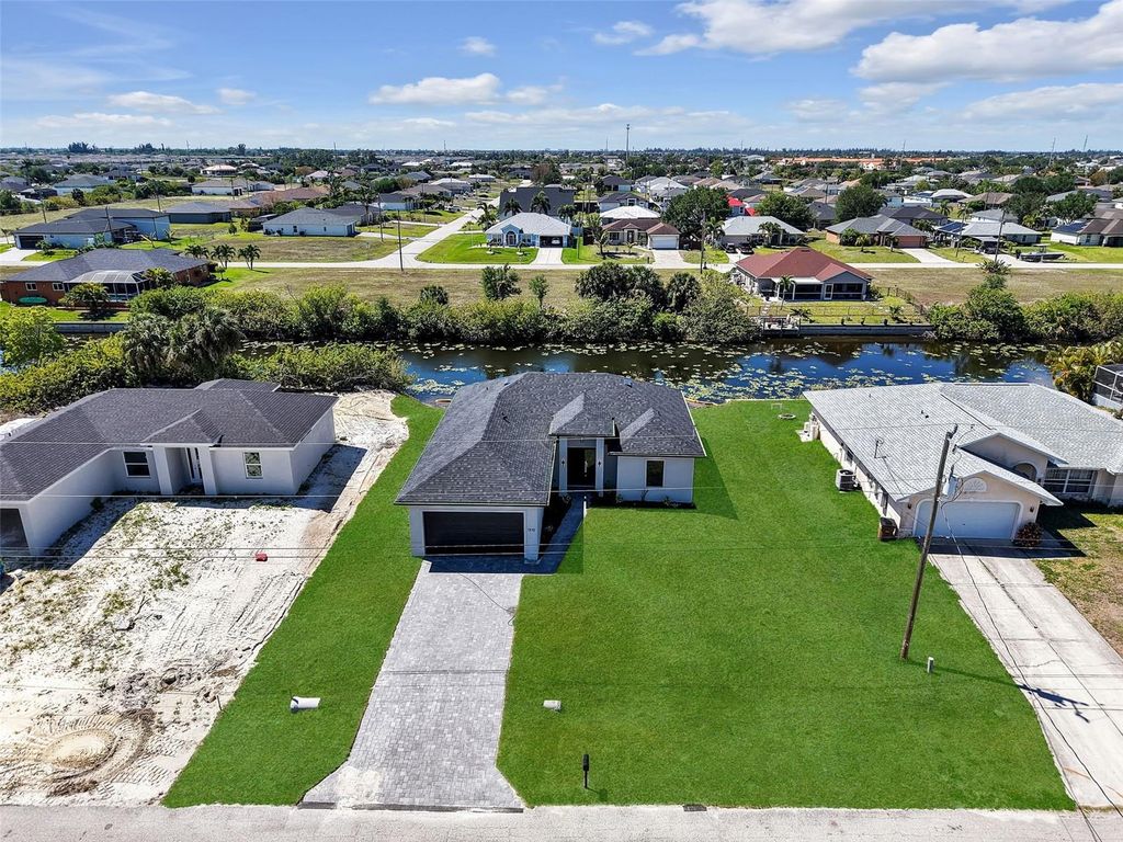 Photo of 1310 NW 11th Terrace, Cape Coral, FL 33993 (MLS # A4690878)