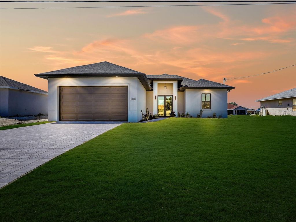Photo of 1310 NW 11th Terrace, Cape Coral, FL 33993 (MLS # A4690878)