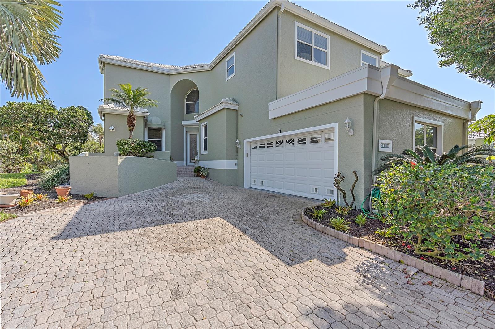 Wonderful opportunity to own behind the secured gates of the highly sought after community of Bay Isles on Longboat Key. There's no shortage of space in this sprawling nearly 4,510 sq ft gorgeous two-story residence in Corey's Landing, with 5 bedrooms and 5 baths there is room for everyone. If plenty of space is what you desire, then look no further! Upon entering through the grand foyer, you’ll bathe in the abundance of sunlight that comes through the numerous windows and walls of sliders in this elegant home, starting in the open Great Room featuring soaring 22ft ceilings, crown molding, chair rails, grand stairs and natural wood flooring. Leading you to the bright Family Room, connecting to the gourmet eat-in Kitchen with plenty of storage and counter space, giving you the perfect open lay out for entertaining. On the first floor you'll find the expansive owner's suite featuring a double door entry, private access to the pool area, sitting area, a large and spacious organized closet system, and owners' deluxe bath with a tub and wide walk-in shower. Also, on the first floor you can find a fifth bedroom that can serve as an office, a full guest bathroom with walk-in shower, laundry room, a spacious 2-car garage, plus the interior elevator to the second floor providing maximum privacy for your family and guests. Heading upstairs you'll find two more generously sized bedrooms, each with en-suite bathroom, plus a Deluxe Suite that could serve as a second master or a heavenly guest suite with a balcony and private access to the pool area. You will love the Sarasota Bay views and Golf Course views from the pool/spa area and three second floor balconies giving you that desired ocean calm every day! Without having a home directly across the street, you are sure to enjoy the openness this home brings, making you feel as if you are surrounded by the gulf waters. Recent upgrades include Roof installed in 2018, AC in 2014 and new one added in 2023, new Spa motor and Pool motor added in 2023, two tankless water heaters in 2017 and 2016, garage door in 2017, and a freshly painted exterior. Corey's Landing offers you a maintenance free lifestyle with all the amenities: two tennis courts, community pool, Kayak access to the Bay, with the Marina minutes away. Bay Isles Beach Club is included in your Corey's Landing home ownership, where you can enjoy the bright sandy beaches of Longboat Key. The Moorings Yacht Club and Marina, Longboat Key Club golf, St Armand's Shopping and Dining are conveniently close to this Bay Isles desirable Longboat Key location. Don't miss an opportunity to own this sunbathed oasis on Longboat Key, schedule your showing today!