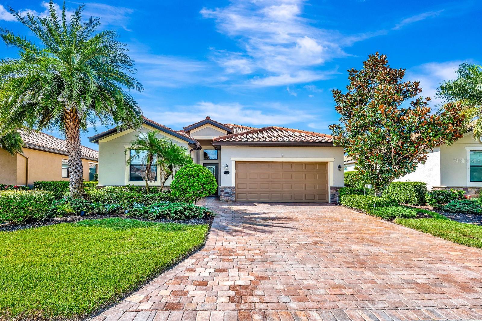 One or more photo(s) has been virtually staged. Discover the perfect blend of luxury, comfort, and a maintenance-free Floridian lifestyle in this beautiful four bedroom, three bath home tucked away on a quite dead end street in the Sanctuary at the gated River Strand at Heritage Harbour community. Built in 2016 and boasting just over 2000 sq ft this residence offers elegance and comfort. The extended paved driveway adds convenience and extra parking, while the community maintains the lush landscaping, allowing you to enjoy your home without the work. The home itself has been thoughtfully updated. Inside you will find no carpet-modern vinyl plank flooring was installed in all bedrooms in 2021, newer refrigerator purchased in 2022 and a washer and dryer added in 2023, while beautiful crown molding in every room enhances the home with a modern fashionable touch. The kitchen has been beautifully updated with an accent wall on the island, a sleek new backsplash and contemporary light fixtures in 2023. You will never worry about space in your master bedroom featuring two large closets with built-in shelving for convenience, and for peace of mind during hurricane season the property is equipped with hurricane shutters. The living room features a stylish oversized fan installed in 2023, fresh interior pains was completed in 2022. The home exterior was painted in 2024 for a modern look. The roof was recently (202) professionally soft pressure washed restoring its fresh and like-new appearance. A whole house water filtration system is another treasured feature and gives you the confidence and peace of mind that your family is enjoying the safest and healthiest water every day- an invaluable feature that adds a significant advantage to maintaining a healthy lifestyle. The extended paved lanai provides generous outdoor space, perfect for entertaining and the outdoor furniture is included in the sale. From the lanai you will enjoy a tranquil pond view with room to add a private pool id desired. The peaceful pond view from the backyard adds a daily dose of serenity and beauty, creating the perfect backdrop for morning coffee and evening relaxation. River Strand is more that just a neighborhood- it is a vibrant lifestyle with a 27-hole championship golf course designed by world-renowned architect Arthur Hills and practice facilities include aqua driving range, putting green and 2 chipping greens. There are nine Har Tru tennis courts, 6 pickleball courts and 8 pools, including two resort-style and six satellite pools with hot tubs and the main clubhouse has a resistance pool. Residents and their guests can enjoy the Shank Shack and Tiki Bar between swims, take part in popular fitness classes and biking groups, or attend social dinner events. Just minutes away are Target, Costco and fine dining, while nearby Bradenton and Lakewood Ranch have more attractions, shopping,, rated A schools and beaches. River Strand is part of a larger master-planned community that ensures a well-preserved environment and a coordinated secure setting, making this home an appealing choice for those seeking the very best of the Florida Lifestyle. Schedule the private showing today and you will not be disappointed. Living a luxury lifestyle can become your reality, all it takes is your first step to make it happen.