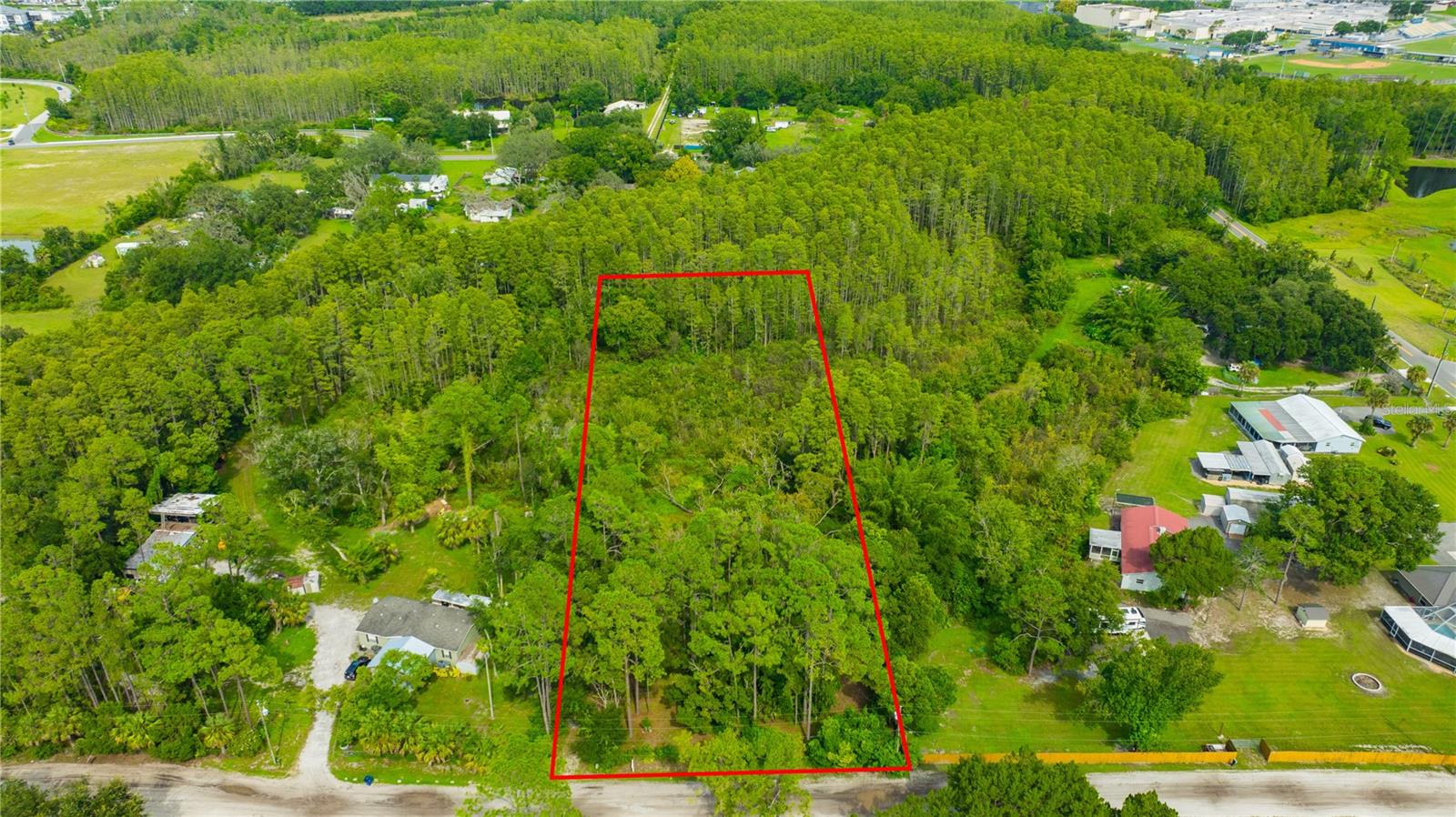 We have the Boundary and Wetland Delineation surveys. Vacant Land Lot for Sale – 1.8 Acres in Land O' Lakes, FL - No HOA - No CDD - Backs Up to Conservation Area, no development behind the property.
This spacious, fenced property, approximately 150 ft x 532 ft, offers the perfect blend of peace, privacy, and convenience.
Utilities are already in place from a previous, older mobile home that was removed by the prior owners.
- Water well
- Septic tank
- Above-ground electric service – ready for hookup
Prime Location:
- Tucked just off Highway 41 with quick access to main roads
- Minutes from Publix, dining, and daily essentials
- Enjoy the serenity of backing up to a conservation wetland area – no rear neighbors, just nature!
No HOA or CDD!
- Bring your boats, RVs, and toys
- Build without the red tape or ongoing fees
Ready for Development:
- Land survey available upon request
- Mostly cleared and usable land – a rare find this size in such a desirable location!
- Very few oak trees, mostly pine trees, the trees provide lots of shaded areas
Don’t miss your chance to own this unique slice of Land O’ Lakes. Schedule a showing today!