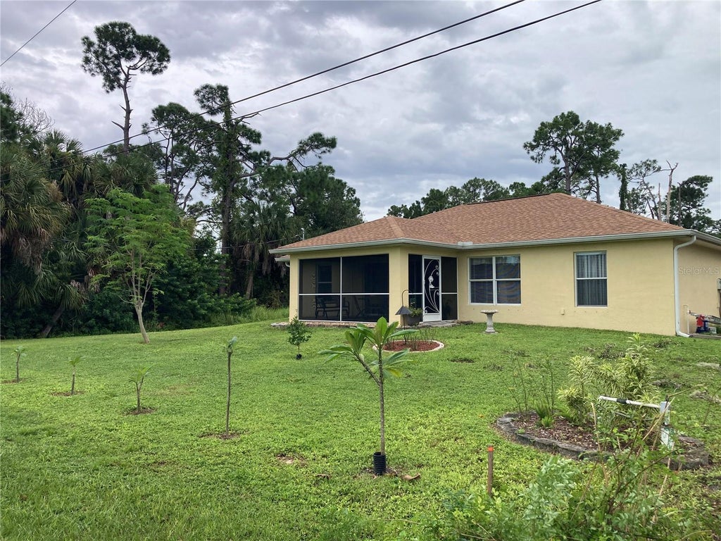 Photo of 14456 Cobb Avenue, Port Charlotte, FL 33953 (MLS # C7531362)
