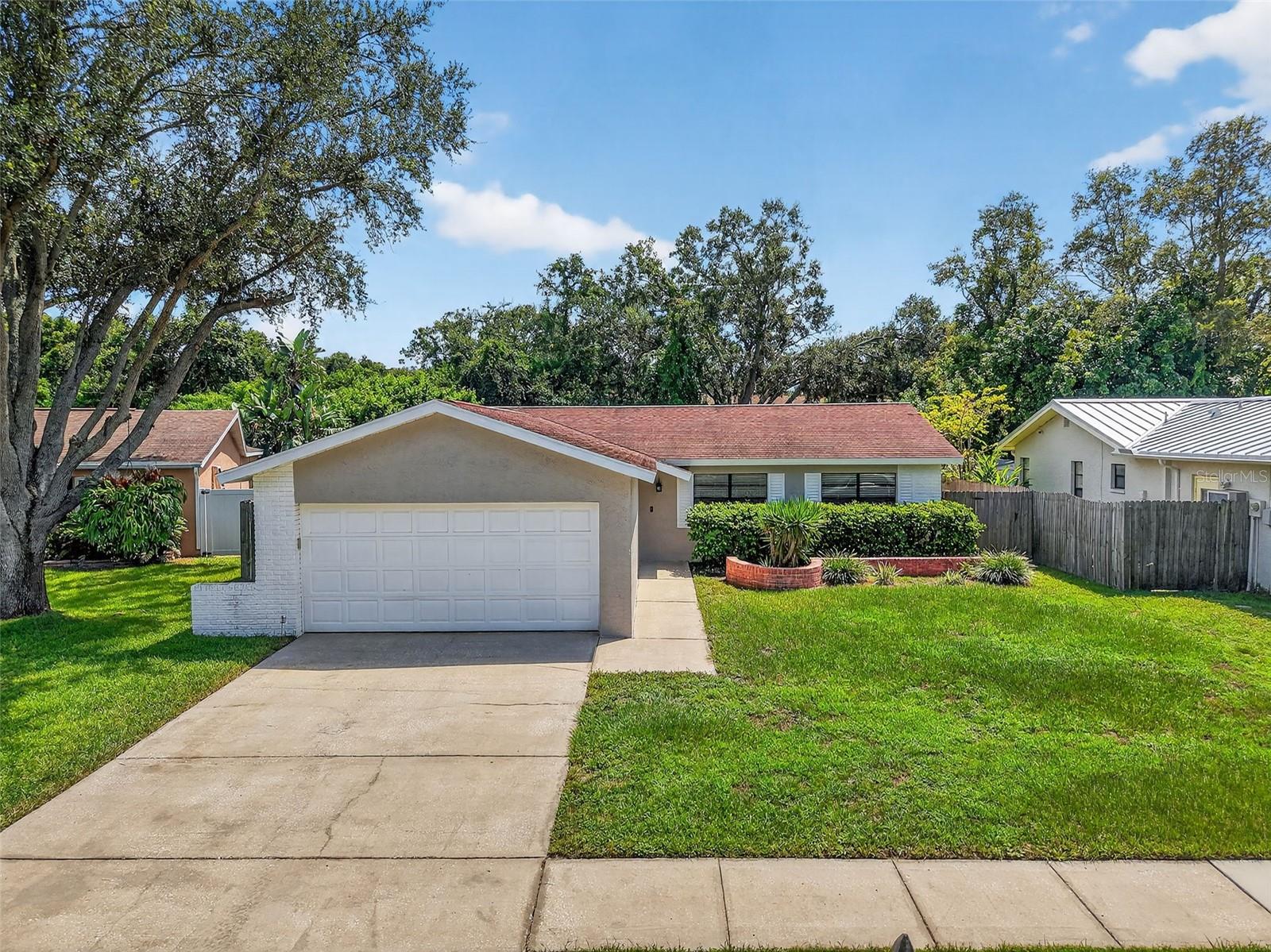 Welcome to this beautifully updated Clearwater pool home. Offering 3 bedrooms, 2 bathrooms, and a desirable split floor plan, this home is move-in ready and designed for both relaxation and entertaining. The newly updated kitchen is truly the heart of the home, featuring granite countertops, stainless steel appliances, a built-in pantry, and abundant storage—ideal for any home chef. The kitchen seamlessly opens to the living area, creating a bright and inviting space. The primary suite boasts a walk-in closet and a fully renovated en-suite bathroom, while the two additional bedrooms share a completely remodeled bath and are thoughtfully placed on the opposite side of the home for added privacy. Step outside and enjoy your own backyard oasis with no rear neighbors. The expansive screened lanai overlooks the sparkling in-ground pool and fenced yard, providing the perfect setting for gatherings, barbecues, or quiet evenings under the Florida sun. Additional features include a two-car garage and the bonus of no HOA fees. Conveniently located near two major airports, excellent shopping, dining, and entertainment, with easy access to US-19 and I-275 for a simple commute. And best of all, world-famous Clearwater Beach is just a short drive away.