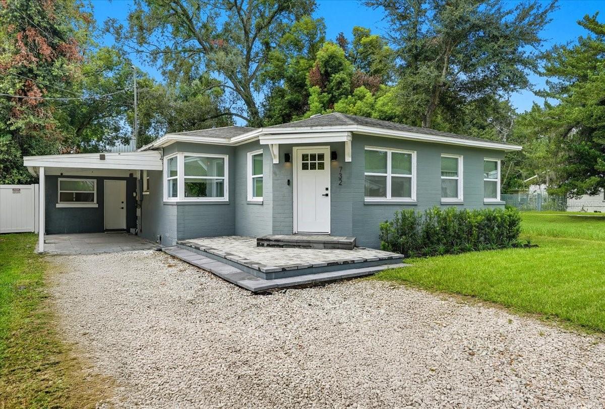 Charming Renovated Bungalow with In-Law Suite near Downtown Orlando! This updated 3-bedroom, 2-bath home offers a rare combination of character, functionality, and location. Situated on an oversized fenced lot with mature oak trees, you’ll enjoy both space and shade while being just minutes from the Creative Village, College Park, and with easy access to I-4 and Colonial Drive. The main home features a modernized living room with an electric fireplace and laminate flooring, an open kitchen with stainless steel appliances and breakfast nook, a den/office with sliding glass doors overlooking the backyard, two bedrooms, and a renovated bathroom. A separate laundry room serves the main house for added convenience. The in-law suite (“granny flat”) has its own private entrance and includes a kitchenette, full bath, stackable washer/dryer, and flexible living/sleeping area—perfect for multi-generational living, guests, or rental income. With a 2018 roof, no HOA, and a versatile layout, this home is move-in ready and ideal for investors or buyers looking to live and generate income at the same time. Don’t miss this opportunity in a prime Orlando location!