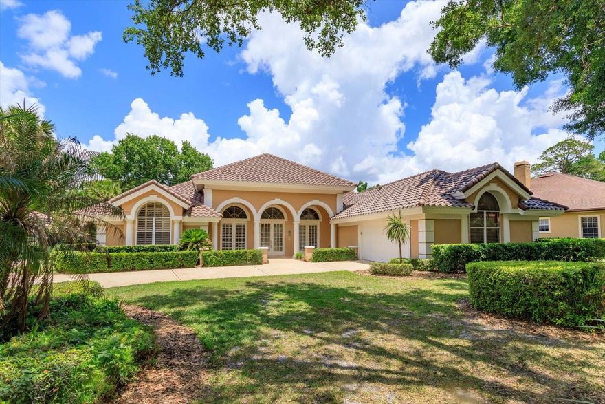 Welcome to this exquisite, custom home with a BRAND-NEW TILE ROOF (May 2026) featuring an elegant entrance with soaring ceilings and resort-style amenities in the guard-gated community of Lake Forest.  This home welcomes you through a double door entryway with 12-foot ceilings flowing seamlessly into a ballroom-like living room complete with a cozy fireplace and an entertainer’s wet bar and wine fridge.  The grand living room design features 3 tall, beautiful French Doors all opening up onto the screened-in pool deck with a serene water feature, creating an indoor-outdoor lifestyle perfect for gatherings that impress.  Designed for elegance, comfort and privacy, this 3217 sq ft split floor plan home has 3 bedrooms and 3.5 baths, a dedicated office and a large custom kitchen and family room combination for those special family nights together.  The kitchen has been updated with 42” solid wood cabinetry with crown molding, soft close doors and pull-out drawers, chef’s prep island with more cabinet storage, walk-in pantry, large breakfast bar with farmhouse sink, and stainless-steel appliances with brand new refrigerator and microwave and a built-in desk for homework time.  In addition, this home features an expansive primary bedroom and en-suite primary bathroom combination with meticulous finishes, 3 walk-in closets and a large Jacuzzi hot tub.  The entire interior of the house has been updated with 24x24 ceramic tile throughout, updated kitchen and bathrooms with granite and marble countertops, solid wood cabinetry, plantation shutters and other beautiful finishes.  This elegant home is a statement of style and comfort offering unforgettable entertaining and quiet, cozy family gatherings.  This home also features a 2 1/2 (oversized) garage to allow for ample space to park cars and have storage and/or workspace.  This home has it all!  Lake Forest offers a 24-hr guard-gated entry with resort style amenities: 10,000 sq ft clubhouse w/ newly remodeled fitness center, Jr. Olympic-sized swimming pool, heated spa, kiddie pool, playground, 55-acre private spring-fed lake, fishing pier, new lighted tennis and pickleball courts & a sports court. The community has been designated as a National Wildlife Habitat. Lake Forest is zoned for Seminole County schools and is close to beaches, entertainment attractions. Easy access to I-4, 417 and 429.