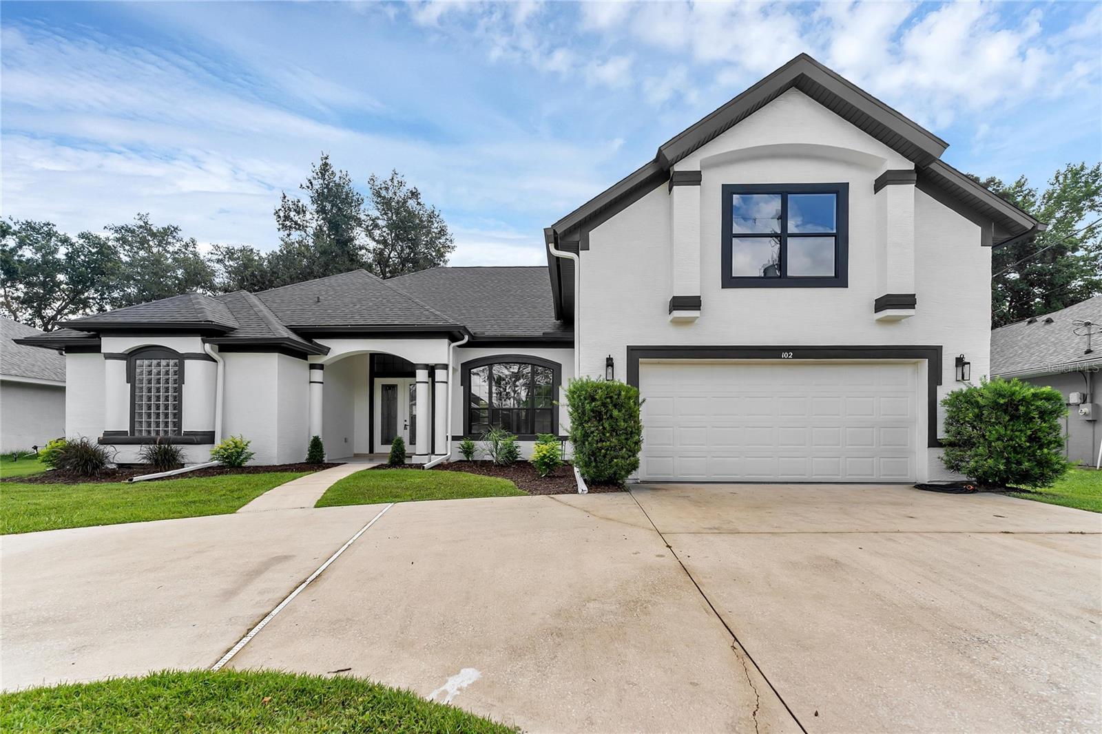 Stunningly Renovated Family Home in the Highly Sought-After Cypress Knolls Golf Community – No HOA! Welcome to this beautifully updated and generously sized family home, ideally located in the prestigious Cypress Knolls golf community with no HOA restrictions. From the moment you step inside, you will be impressed by the grand entrance, soaring ceilings, and an abundance of natural light that fills the space through oversized windows, creating a bright and airy atmosphere. At the front of the home, the formal living and dining rooms offer a refined setting for entertaining and special gatherings. The heart of the home features a modern, fully renovated kitchen with solid wood cabinetry, sleek quartz countertops, stainless steel appliances, and a cozy dinette area. The adjacent family room is both warm and inviting, anchored by a stunning stone fireplace and large windows framing serene views of the backyard and pool. Designed with privacy in mind, the thoughtful split floor plan places the luxurious primary suite on one side of the home. This tranquil retreat boasts a tray ceiling, sliding doors that open to the pool area, and a fully renovated spa-like en-suite bath complete with a freestanding soaking tub, oversized walk-in shower, dual vanities, private water closet, and his-and-hers walk-in closets. On the opposite side, three additional bedrooms and a stylishly updated full bathroom provide comfortable accommodations for family or guests. Upstairs, a private guest suite with its own full bath is perfect for visiting family or an in-law arrangement. A separate staircase leads to a spacious loft or bonus room with its own private bathroom, ideal as a media room, home office, gym, or even an additional guest suite. The outdoor living space is just as impressive, featuring a large covered lanai perfect for entertaining or enjoying quiet evenings. The enclosed pool and spa area has been freshly resurfaced and re-grouted, with a newly rescreened enclosure ready for you to enjoy the best of Florida living year-round. Extensively renovated in 2025, this home includes a brand-new roof, two new HVAC systems (one for each floor), fully remodeled bathrooms, upgraded plumbing and electrical fixtures, luxury vinyl plank flooring throughout the first floor, high-quality carpet upstairs, fresh paint inside and out, updated landscaping, and a new exterior door to the pool bath. The kitchen and bathroom vanities are all outfitted with solid wood cabinetry and finished with quartz stone countertops. Even the fireplace has been updated with a beautiful new stone surround. This spacious, move-in-ready home offers style, comfort, and flexibility to suit any lifestyle. Don’t miss this rare opportunity—schedule your private showing today before it's gone!