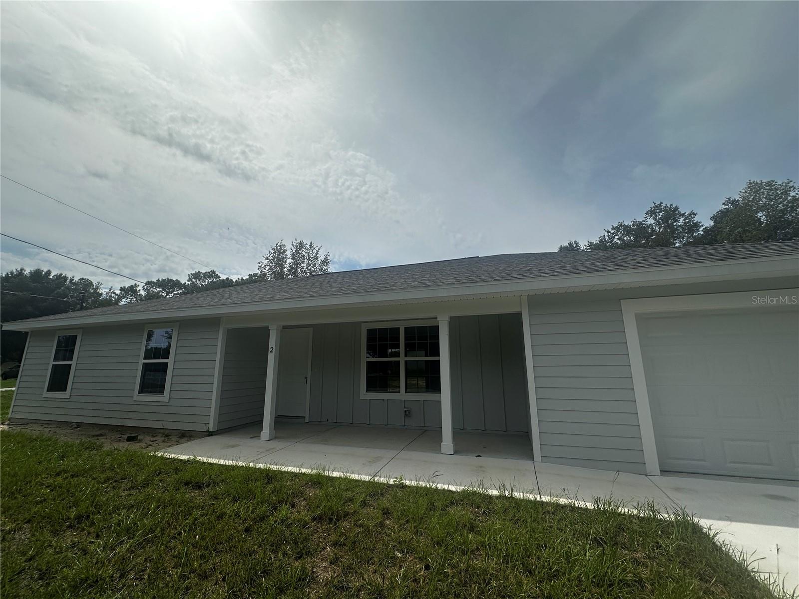3 bedroom new construction home located in Silver Springs Shores, lvp flooring in wet areas and carpet in bedrooms, modern color scheme, bright and clean! Bathrooms feature tub in one and walk in shower in the other, kitchen has stainless steel appliance, granite countertops, easy close cabinets, very large walk-in pantry, and so much more!
