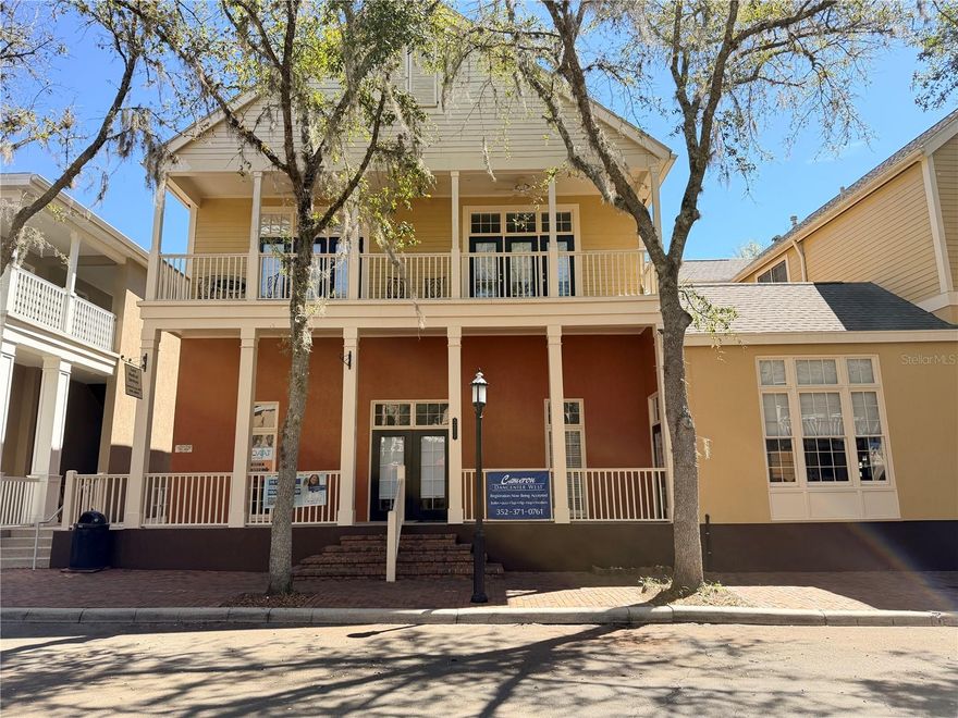 Beautiful second floor apartment in the heart of the Haile Plantation Village Center. Enter through a gated brick courtyard, go up one flight of stairs and enter a spacious 2BR/2BA, 1250sqft apartment. Includes: Wood floors, granite counters, stainless appliances, crown molding, built in entertainment center, gas fireplace, private balcony, washer & dryer. This unique apartment feels like a single family home, with NO connecting walls to another unit. Enjoy relaxing on the balcony or the large courtyard below. Very special, must see!