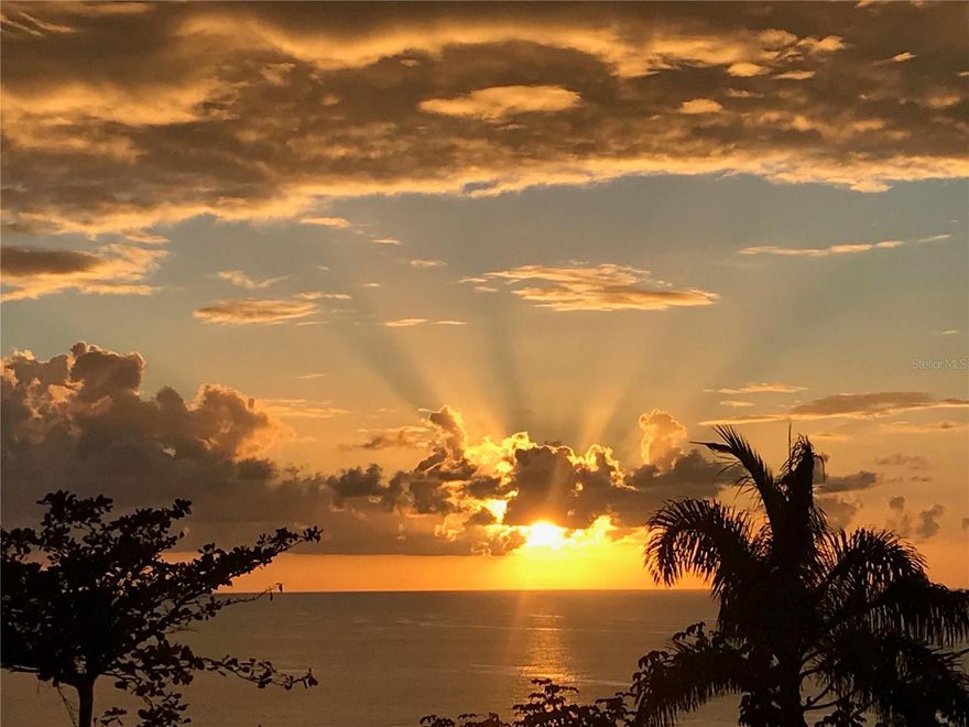 Panoramic ocean views from this rare multi-unit fixer-upper is a true diamond in the rough. Wake up to the sound of waves and unwind each evening with breathtaking sunsets that paint the sky in brilliant hues of gold, pink, and crimson.This property offers multiple units, making it an exceptional opportunity for investors, developers, or visionaries looking to create a stunning coastal retreat. Each unit captures sweeping water views, refreshing sea breezes, and abundant natural light. With solid bones and endless potential, this is your chance to renovate and customize while significantly increasing value.Imagine transforming these spaces into modern coastal residences, vacation rentals, or a boutique seaside escape — all in a location where the ocean feels like your backyard.

Opportunities like this are rare: incredible views, income potential, and the chance to design your dream coastal investment in the highly renowned neighborhood of Puntas, Rincon. The top floor has 3 bedrooms with an office/den that connects the primary bedroom to the living room. It also includes a kitchen, laundry room and full bathroom, plus a massive open terrace off the back of the house ideal for watching the iconic sunsets of Western Puerto Rico. Downstairs is an in-law suite with 2 bedroom, 1 bathroom, living room, kitchen and attached carport with additional storage room (which could be converted to another bedroom). Off the back of the house is endless potential with a covered area that is approximately 520 SqFt (20ft X 26ft) with an extremely high ceiling to allow for multiple possibilities. Just behind this covered area is the remnants of a workshop that is approximately 534.75 SqFt (15.5ft X 34.5).  Although this old workshop is uncovered it still has half of the walls standing and the other half has 3ft high cinderblock walls, giving the property the potential of four separate units.

Bring your contractor and your imagination — the sunsets are already included.
