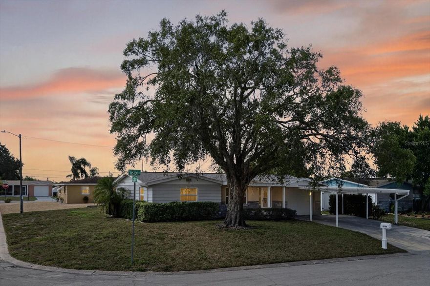 One or more photo(s) has been virtually staged. Welcome home to this beautifully maintained 2-bedroom, 1-bath corner-lot home in Holiday, Pasco County! Offering 930 sq ft of living space plus a bright bonus room (approx. 1,013 sq ft total), this move-in-ready property blends comfort, updates, and peace of mind.

Step inside to a light and airy layout with fresh neutral paint, tile flooring throughout the main areas, and new carpet (Sept 2025) in both bedrooms and the bonus room. The kitchen features solid wood cabinetry, stainless-steel appliances, and a sunny window overlooking the backyard. The flexible bonus room is perfect for dining, an office, or a creative space. The bathroom has been tastefully refreshed with an updated vanity, tile, and modern tub surround.

Recent upgrades include a new roof (2024), updated electrical panel (Apr 2025), and A/C service (Apr 2025). A pre-listing inspection was completed with all four-point items marked satisfactory. The home has been professionally pressure washed and tile floors steam cleaned, ensuring a spotless presentation.

Enjoy your morning coffee or dinner with friends in the screened-in patio overlooking the backyard. The garage features a freshly painted floor, washer/dryer hookups, and an included tool bench, perfect for hobbyists or extra storage. Security cameras convey with the property, offering added peace of mind.

Conveniently located near shopping, dining, parks, and Gulf beaches, this home offers easy Florida living at its best.