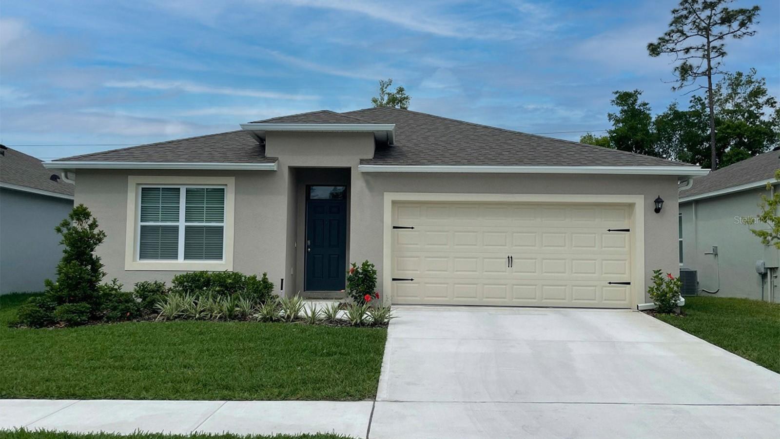 Under Construction. "Introducing the Cali floorplan at Magnolia Point, in Umatilla, Florida, where every square foot is put to use with sophistication and comfort. This home features modern details that elevate your personal style, including luxury vinyl plank flooring throughout.
Inside this 4-bedroom, 2-bathroom home, you’ll find 1,882 square feet of comfortable living. This meticulously designed residence combines modern convenience with timeless elegance, showcasing granite counters and luxury vinyl plank flooring throughout.
As you step inside, you are greeted by an inviting foyer that leads you into the heart of the home. The open-concept layout seamlessly connects the living room, dining area, and kitchen, creating a perfect space for entertaining family and friends. The spacious living room features abundant natural light, thanks to large windows that provide picturesque views of the surrounding landscape. With ample room for seating, it's an ideal spot for relaxation and gatherings.
The kitchen is a true highlight, including granite countertops, sleek stainless steel appliances, a walk in pantry and an oversized island with a breakfast bar. Whether you're preparing a casual meal or hosting a formal dinner, this kitchen is well-equipped to meet your culinary needs.
The four generously sized bedrooms with flexibility for various lifestyles. The primary suite located in the rear of the home is a tranquil retreat, featuring a private ensuite bathroom with dual sinks, a separate shower, and a walk-in closet. The remaining three bedrooms share one well-appointed bathroom, making morning routines a breeze. Laundry won't be a chore with it's dedicated space convenient to all bedrooms.
Like all homes in Magnolia Point, the Cali includes smart home technology, which allows you to control your home anytime with your smart device while near or away.
Whether you're seeking a peaceful family retreat or a stylish place to call your own, this home is sure to meet your every need. Contact us today and find your home.
*Photos are of similar model but not that of the exact house. Pictures, photographs, colors, features, and sizes are for illustration purposes only and will vary from the homes as built. Home and community information including pricing, included features, terms, availability, and amenities are subject to change and prior sale at any time without notice or obligation. Please note that no representations or warranties are made regarding school districts or school assignments; you should conduct your own investigation regarding current and future schools and school boundaries. *