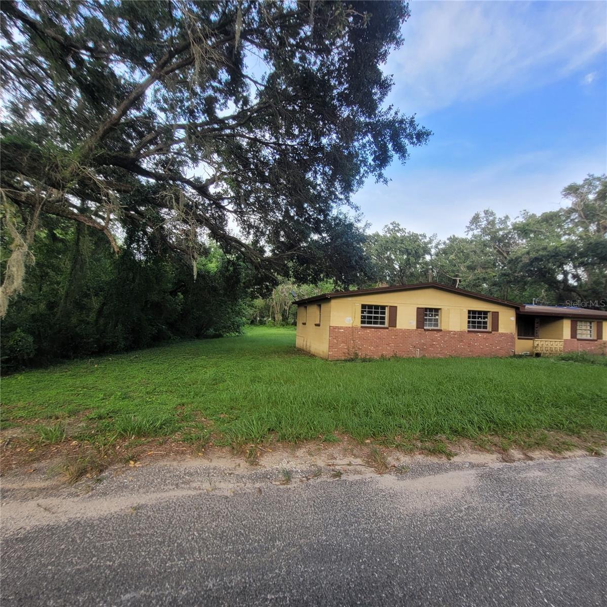 Solid property that just needs some interior decorations and updating. Lots of potential with available land .73 acres.