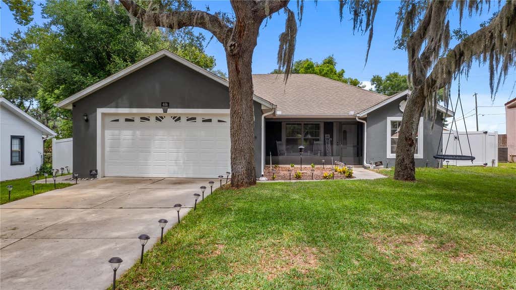 Photo of 406 S Palm Avenue, Howey In The Hills, FL 34737 (MLS # O6416440)
