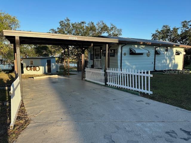 NO LOT RENT, it is a deeded lot, 2 bedrooms 1-1/2 Baths on Tooke Lake. 2 wall units for A/C the heat is run with a heat pump. 12 x 22 Carport, 12 x 8 Shed, 16 x 12 deck. Must see! Horseshoes, Tennis, Community Pool, Miniature Golf, Shuffle Board, Basketball Court and much more. Dues include water & sewer, trash pickup & lawn maintenance from April 1 to October 1. Free internet at the clubhouse, free storage (subject to availability and upon request) for RV, Boat, Trailer etc.