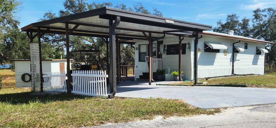 NO LOT RENT, it is a deeded lot, 2 bedrooms 1-1/2 Baths on Tooke Lake. 2 wall units for A/C the heat is run with a heat pump. 12 x 22 Carport, 12 x 8 Shed, 16 x 12 deck. Must see! Horseshoes, Tennis, Community Pool, Miniature Golf, Shuffle Board, Basketball Court and much more. Dues include water & sewer, trash pickup & lawn maintenance from April 1 to October 1. Free internet at the clubhouse, free storage (subject to availability and upon request) for RV, Boat, Trailer etc. 15 year Silicone Roof September 2025. Golf Cart included.