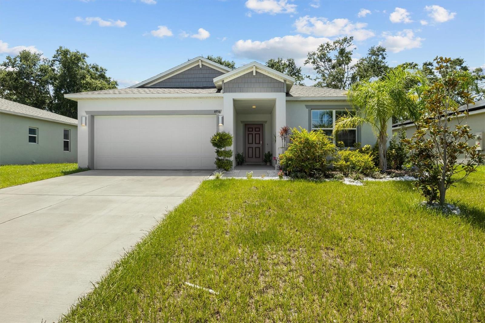 Welcome to your dream home in the heart of Winter Haven! Built in 2023, this beautifully designed 4-bedroom, 2-bath residence offers modern living with exceptional convenience. Step inside to find a bright, open-concept layout with ceramic tile flooring throughout the main living areas and a spacious kitchen complete with a large island — perfect for entertaining. Enjoy your mornings or evenings on the screened-in lanai, ideal for outdoor dining or relaxing in your private backyard retreat. Located just minutes from top shopping destinations, major attractions, and nearby middle school, this move-in-ready home is perfectly positioned for both comfort and lifestyle. Don’t miss out on this incredible opportunity!