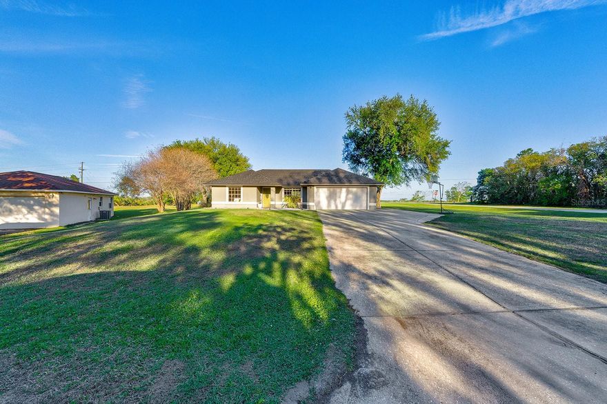 Flooded with natural light, this cozy nest sits on just over half an acre with no HOA. The perfect spot for growing families. The huge, sun drenched private pool and pool deck extend the living areas making outdoor family time an everyday option. The central kitchen is the heart of the home and opens to spacious living room - perfect for hosting - game nights or just family dinner. This cheerful home is one that needs to be seen. This practical floor plan has a well sized Primary on one side of the living area and the other bedrooms share a bathroom on the opposite side of the home. With brand new luxury vinyl throughout, 2024 AC and New roof installed in 2025 this home is not only beautiful, it comes with peace of mind. Walking distance to Pine Ridge Elementary.