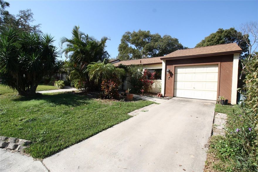 Single family home in quite community .., 4 bedrooms and 2 full bathrooms,  with brand new AC system , this residence provides a comfortable and spacious well-designed layout ideal for relaxed living. The kitchen stands as a delightful focal point, stone countertops completely open to family, living and dining rooms! The primary bedroom serves as a private sanctuary, boasting a spacious walk-in closet and sliding glass doors that lead out to the fenced backyard. The exterior highlights a sizeable fenced-in back yard and a single car garage. Property is located walking distance of multi lakes adding to the home's appeal and close to tranquility of Sunset Park. Perfect relaxation and enjoying nature's beauty just steps away from your doorstep includes access to the community pool and tennis courts.