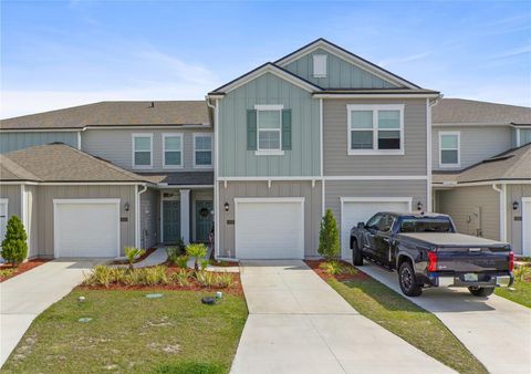 Photo of 117 Redbud Road, Palm Coast, FL 32137 (MLS # TB8366457)