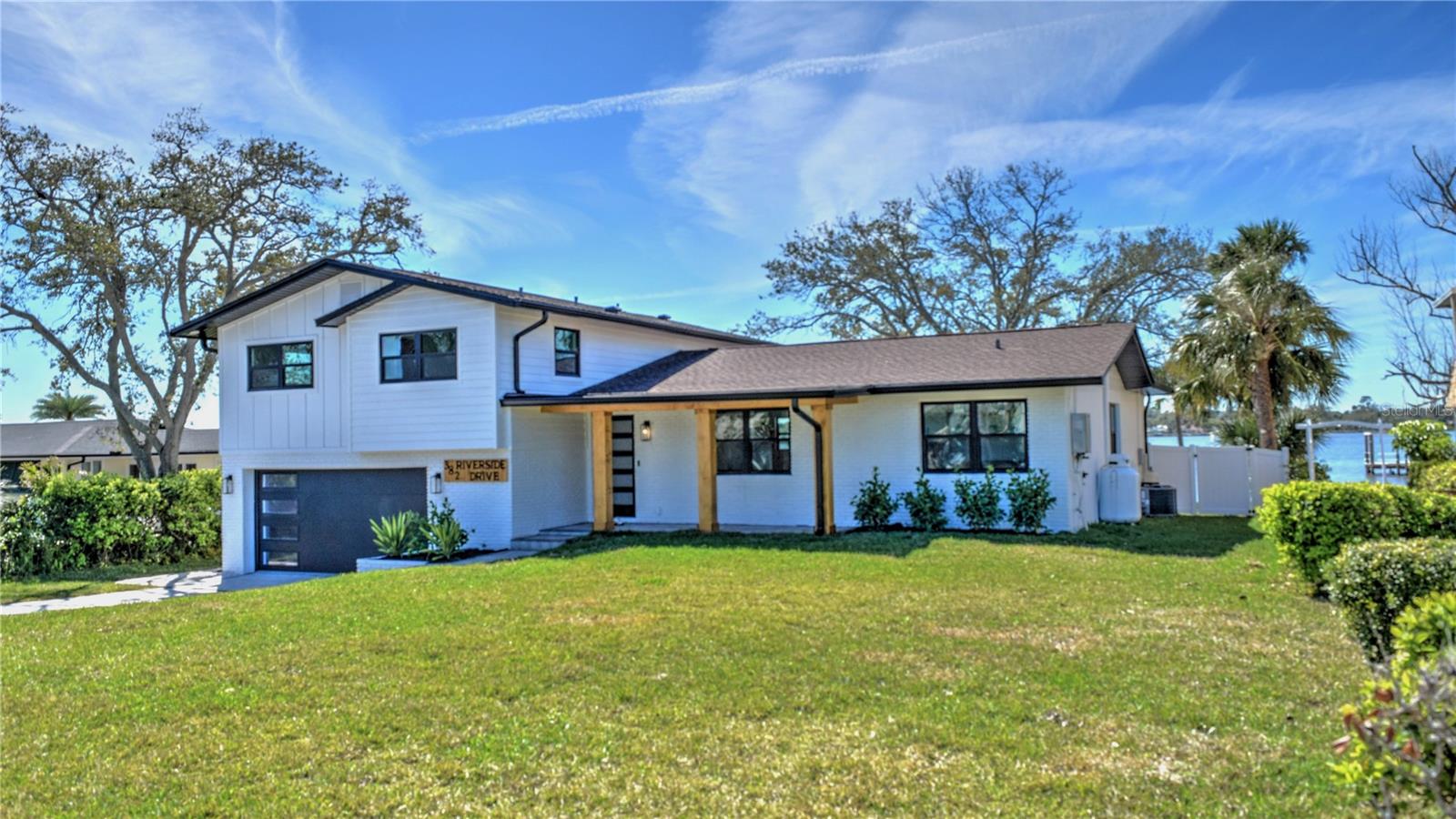 Experience the ultimate waterfront living in this completely renovated, custom pool home on the Intracoastal Waterway in beautiful Ormond Beach, FL. Located on Riverside Dr., this stunning residence is just a short stroll to the ocean, offering the perfect blend of beachside tranquility and luxurious comfort. Step inside and be captivated by the open-concept smart home design, ideal for entertaining and family living. As you walk through the front door you are greeted by the dining room, complete with custom cabinetry and a wine cooler, flowing seamlessly into the modern chef's kitchen. This culinary masterpiece features quartz countertops and backsplash, an 8-burner Thermador gas range, a wall microwave/oven combo, a Thermador refrigerator and separate freezer, dual dishwashers, dual sinks, and a large island with seating for six. Two sets of bi-fold doors lead out to an expansive composite deck and paver pool deck provides breathtaking views of the river. With four bedrooms and four bathrooms you will have plenty of room for family and guests. Imagine relaxing by the pool or on your private dock, watching manatees, blue herons, and dolphins play in your backyard. This home has been meticulously updated with all-new windows and doors, a new pool, all new paver driveway and pool deck, a new composite deck and balcony, new dual AC systems, and completely new electrical and plumbing. All information is deemed to be correct but should be verified by the buyer and buyers agent.