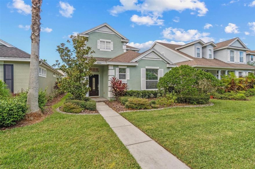 Welcome to 20033 Heritage Point Dr in Tampa - Soaring ceilings and abundant natural light create a bright and inviting atmosphere from the moment you step inside (and pristinely clean!) The thoughtfully designed floor plan balances functionality and comfort. The kitchen boasts stainless steel appliances, a natural gas stove and breakfast bar. The spacious primary suite is located on the ground floor and features hardwood flooring as well as an en-suite bath with dual vanities and a walk-in closet. A separate laundry room is located off the kitchen, along with a handy and spacious under-stairs storage area and a powder bath also located on the main floor. Upstairs, you'll find three nice sized bedrooms, a full bathroom, and a loft flex space, ideal for a home office, workout area, or playroom. Grand Hampton amenities include: Premium fitness room - beautifully designed clubhouse - resort-style pool - lap pool - playgrounds - tennis courts - pickle ball courts - fishing pier - nature trails - fiber optic internet - Community events. Grand Hampton offers more than just a home; it's a lifestyle. With a full time Lifestyle Coordinator consistently planning community events. Every day is filled with endless possibilities for recreation and relaxation. Conveniently located with easy access to major highways, shopping, dining, and entertainment, Grand Hampton provides the perfect blend of convenience and luxury.