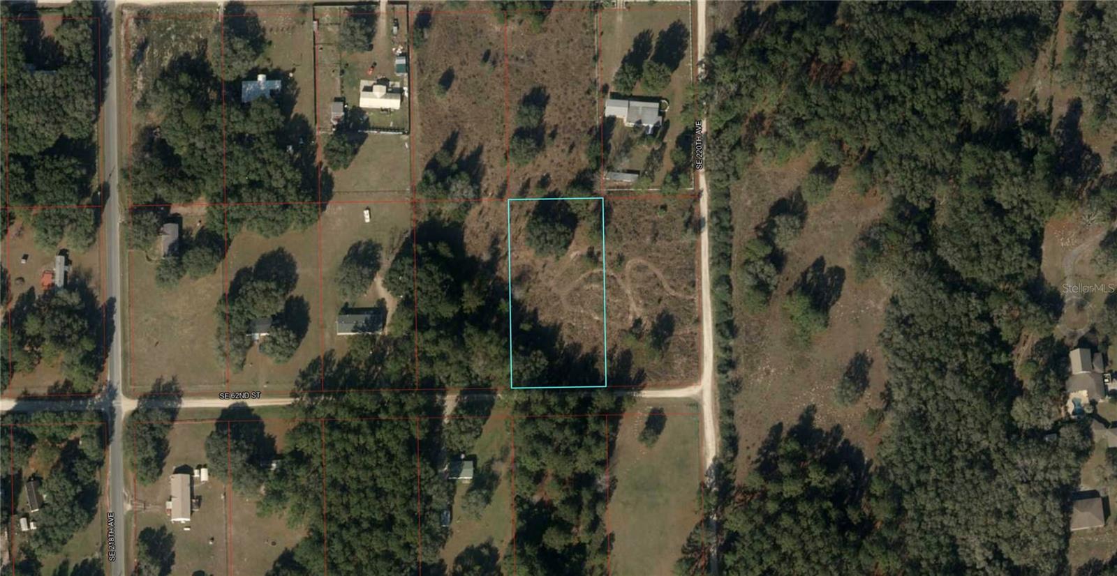 1.25 acres just a few lots off the PAVED ROAD in Ocala Highlands West. Mobile/manufactured homes or site-built homes are OK here! The property is just across the county line from Marion County. This property is Levy County parcel 09611-010-00. The property looks to be already cleared of some trees in the middle, potentially saving you thousands of dollars in tree removal costs VS. buying a lot with heavy trees. NO flood zone to worry about. The parcel measures about 165' x 330'. It is located on a well developed block with electric service readily available. Away from the cities in the country, you can still commute to Ocala in less than 25 minutes. Bring your animals and build your mini farm. Enjoy lower Levy County taxes. GPS coordinates to center of property: 29.239589, -82.404388. Enter coordinates into Google or Apple maps for directions. Listing address is not an official address and is just for mapping purposes.
