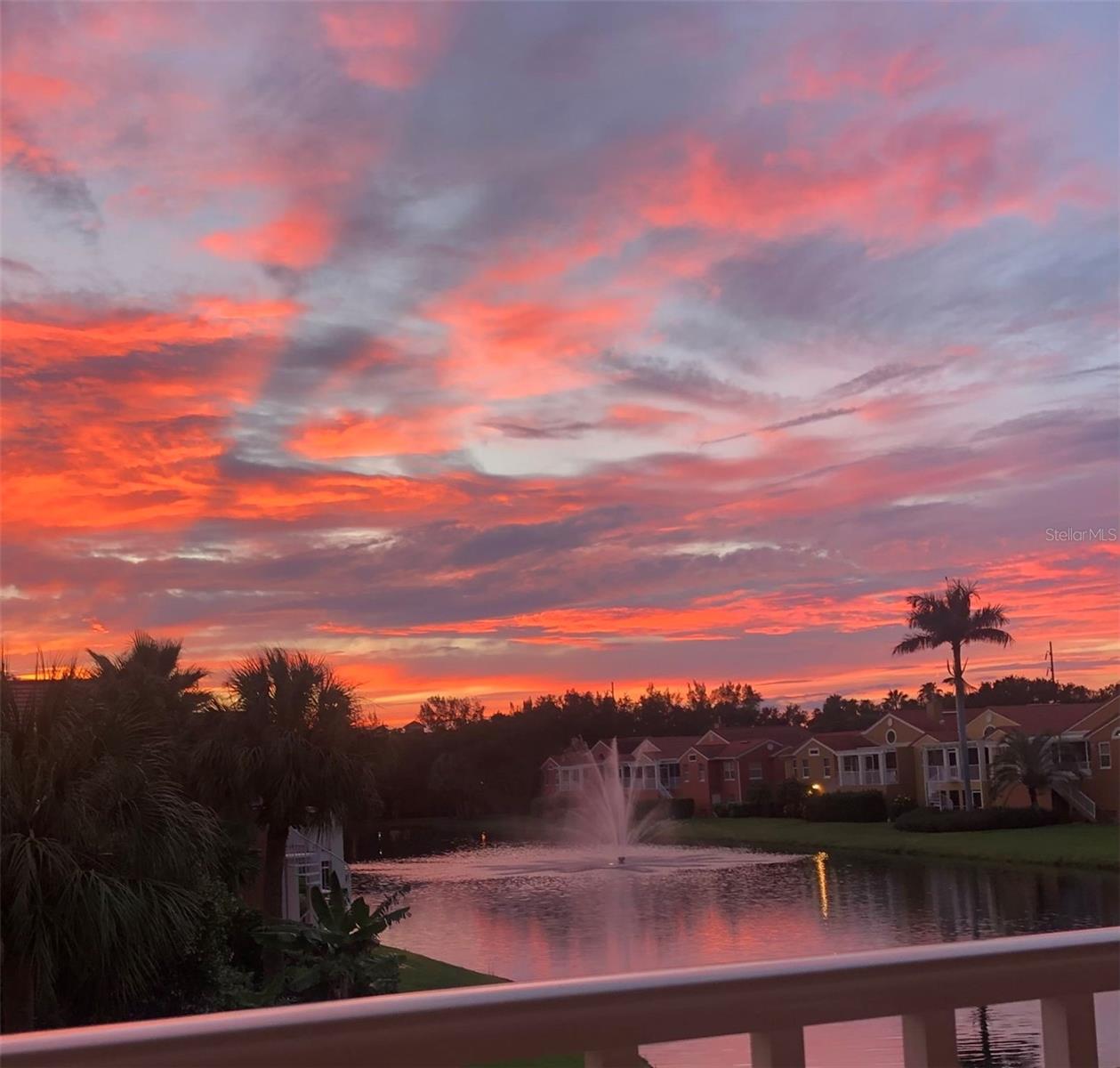 Offered for lease and fully furnished, this elevated end-unit townhome in Marina Bay blends Mediterranean-inspired design with modern comforts and tranquil lake views. In a gated waterfront community just minutes from beaches and downtown St. Petersburg, the home features 2,574 square feet of single-level living with soaring vaulted ceilings and private elevator access. The spacious three-bedroom, 2.5-bath layout includes a gourmet kitchen with natural gas cooking, Cambria countertops, high-end appliances, elegant pendant lighting and an oversized walk-in pantry. Designed for everyday living and effortless entertaining, the home also offers a built-in bar with wine refrigerator, surround sound, remote-control blinds and a cozy writing nook. The covered lanai provides a peaceful setting for outdoor relaxation year-round. The luxurious owner’s suite features dual walk-in custom closets and a spa-style bath with double vanities, a soaking tub and a tiled walk-in shower. A five-car garage with epoxy flooring and custom lighting offers incredible flexibility for vehicle storage, a home gym, workshop or recreational space. Built to FORTIFIED Gold™ standards, this residence offers enhanced structural integrity with impact-rated windows and doors, as well as a whole-house 22-kilowatt natural gas generator for added security and comfort. Residents enjoy access to Marina Bay’s resort-style amenities, including two pools, two spas, a fitness center, clubhouse, fishing pier and direct access to the 60-mile Pinellas Trail. For boating enthusiasts, two deepwater boat slips with high-capacity lifts (14,000 and 20,000 pounds) are available for rent separately from the owner. Enjoy the ease of fully furnished luxury living in a quiet, pet-friendly waterfront community.