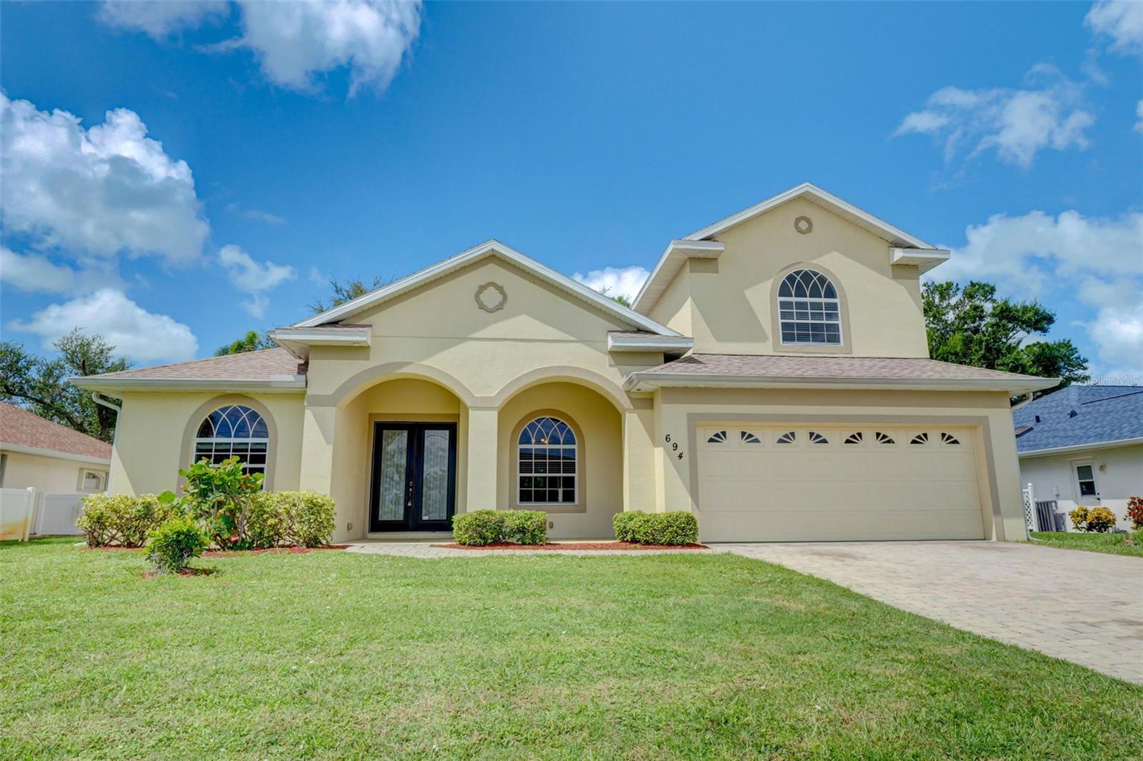 ENJOY the beauty and comfortable flow of this well planned 4-bedroom 3-bath custom quality home built by La Maison Homes in the Golf Course Community of Rotonda West. NEW ROOF 2022, NEW AC 2019. This light and bright open floor plan is highlighted with a double door covered entry, living room with high tray ceilings and fireplace, ceramic tile floors, beautiful wood cabinets, stone counter tops in the kitchen with center workstation. Other upgrades include a central vacuum system, large Master Suite with walk-in closet, and ensuite bathroom with two separate vanities/sinks, walk in shower, and garden tub. The 4th bedroom on the 2nd floor can be used as a family room, theater room, den, or exercise room and also has an Ensuite Bathroom. This community offers our “Florida Lifestyle” known for its world class golfing, fishing, and boating located between beautiful Boca Grande and Englewood Beaches. CHECK OUT THE VISUAL TOUR AND FLOOR PLAN: