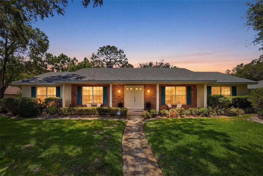 One or more photos is virtually staged- NEW ROOF- Welcome to 5082 Jennifer Place — a stunning concrete block home on a coveted CORNER LOT in the heart of Dover Manor, where meticulous craftsmanship, timeless character, and an unbeatable location come together in a way that is truly rare.

From the moment you arrive, the curb appeal stops you in your tracks. A grand covered front porch framed by beautiful brick accents and stately columns sets the tone for the elegance that lives inside. Lush, manicured Saint Augustine grass lines the grounds, and the landscaping is nothing short of immaculate — the kind of pride of ownership you feel before you ever step through the door.

Step inside your grand double door entry and feel the difference immediately. This home was built with materials you simply cannot find in today's construction: solid 1×12 pine wood sheathing, solid hardwood doors throughout, and custom-designed decorative baseboards in the dining room that gives the space a character all its own. Crown molding, generous room sizes, and a thoughtful floor plan make this home feel both spacious and warm.

The family room is anchored by a classic wood-burning fireplace — the perfect centerpiece for cool Florida evenings. The kitchen features newer appliances including a BRAND NEW refrigerator, and while it carries timeless style, it's ready for your personal touch. The REMODELED master bath delivers the modern comfort you deserve, and brand new carpet has just been installed throughout, making this home truly move-in ready.

Beyond the beauty, the bones are impeccable. A new roof , updated water lines, a newer electrical panel, and an updated hurricane-rated garage door mean all the big-ticket items are done. The 2-car side-facing garage adds to the clean, classic exterior aesthetic. Also enjoy a spacious laundry room. A PRIVATE, fully fenced backyard, with a screened-in covered patio, and vinyl fencing that gives you a peaceful outdoor retreat all your own.

And the location? It's hard to overstate. Zoned for the highly sought-after Boone High School in an A-rated school district, and situated just minutes from Downtown Orlando, SODO, Conway, Belle Isle, the Orlando International Airport, and major turnpike access — this is the kind of address that puts everything within easy reach.

Dover Manor is one of Orlando's most desirable established neighborhoods, and corner lots like this rarely come available. Whether you're drawn in by the craftsmanship, the location, or that unforgettable front porch — this is a home you simply have to see.

Take a look at this timeless beauty today!