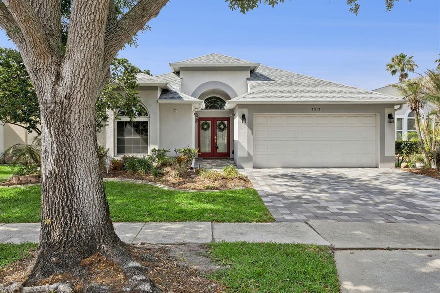 Located in a gated community and set on a private lot with no rear neighbors, this home combines thoughtful updates, energy efficiency, and comfortable everyday living.  Offering 3 bedrooms, 2 baths, 1,800 square feet, and a 2-car garage, the layout is both functional and inviting. A standout feature is the solar panel system paired with a Tesla Powerwall battery, providing energy storage and backup power.  
Major improvements include a new roof (2025), replumbing (2015), and hurricane-impact windows, along with an insulated garage door. Smart home features—thermostat, lighting, and doorbell—are all app-controlled, and the home is equipped with an alarm system.  Inside, wood-look laminate flooring runs through the main living areas. The kitchen offers a blend of style and function with glass-panel cabinetry with crown molding, a tumbled marble backsplash, and pull-out drawers. The primary suite includes dual vanities, a walk-in closet, a garden tub, and a separate shower. The secondary bath has been remodeled and features with travertine tile.  The backyard is designed for Florida living, featuring a private chlorine pool and open space behind the home for added privacy. No rear neighbors!  Additional features include a paver driveway, attic storage with added flooring, and an included GE upright washer and dryer.  A well-rounded property with a strong combination of updates, features, and setting, call for your private showing today!
