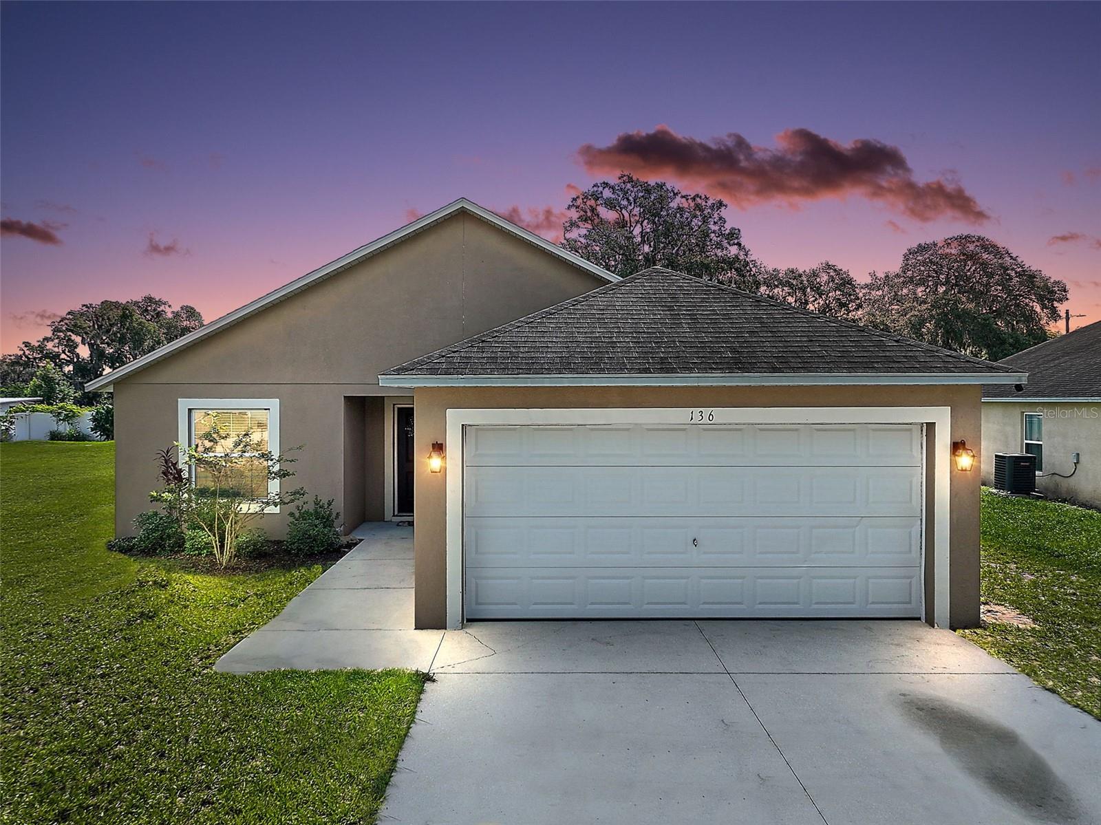 Welcome to 136 Cataldo Way, a charming 3-bedroom, 2-bathroom home nestled in Groveland, Florida. This delightful residence offers just over 1500 square feet of comfortable living space, designed with both style and practicality in mind. Step inside to discover luxury vinyl plank flooring gracing the main living areas and the primary bedroom, providing a sleek and modern aesthetic that is also easy to maintain. The secondary bedrooms offer cozy comfort with newly installed carpet in 2025 AND walk-in closets. For added convenience, all "wet areas," including the kitchen, bathrooms, and laundry room, feature durable tile flooring. Thoughtful details abound, with every bedroom providing a spacious walk-in closet and a ceiling fan, ensuring comfort and ample storage for all. The backyard is a true highlight, fully enclosed with a vinyl privacy fence, offering a perfect setting for outdoor enjoyment and relaxation. This home seamlessly blends desirable features with a functional layout, creating an inviting atmosphere you'll love to call your own. The original French doors have been upgraded to a sliding glass door in the living room, allowing for more light to enter the living space. The kitchen sink was upgraded to a large drop-in single sink bowl for convenience and aesthetics. Experience the ease of living at 136 Cataldo Way.