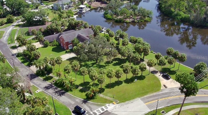 Amazing location to build your dream home with water views and Gulf access! Bring your boat and enjoy the Salt Life! Oversized parcel (155x182) will give you plenty of room to design and build. Located in central Tarpon Springs and a few blocks from all three schools, both local beaches and downtown. Public underground utilities available. No deed restrictions or HOA.