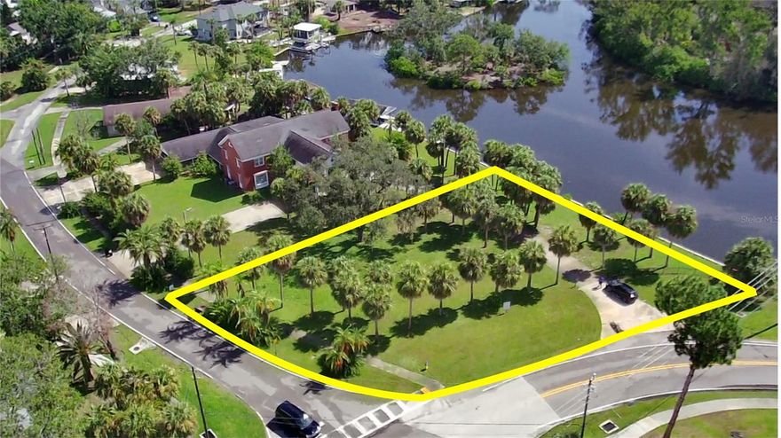 Amazing location to build your dream home with water views and Gulf access! Bring your boat and enjoy the Salt Life! Oversized parcel (155x182) will give you plenty of room to design and build. Located in central Tarpon Springs and a few blocks from all three schools, both local beaches and downtown. Public underground utilities available. No deed restrictions or HOA.