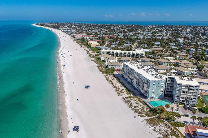 Sweeping Gulf sunsets, sugar-white sand, and the unmistakable charm of Anna Maria Island — now offered at a refreshed price. Perched on the 5th floor of the Martinique, this rarely available beachfront residence puts the entire horizon at your feet, where turquoise water stretches as far as the eye can see and the nightly sunset show never plays the same way twice.
Floor-to-ceiling glass pulls the Gulf straight into the open living space and primary suite, with sunlight shifting from gold to rose to amber across the day. Inside, a crisp coastal palette of stone countertops, shaker cabinetry, and a generous breakfast bar makes entertaining effortless, while two spacious bedrooms and two full baths offer comfort and privacy for family and guests.
Beyond your door, the Martinique delivers true resort living — heated beachfront pool, tennis courts, and direct access to powder-soft sand and the calm, shimmering Gulf. A deeded garage and private storage keep paddleboards, bikes, and beach gear at the ready.
And then there's the island itself. Anna Maria's seven-mile ribbon of old-Florida charm is yours to roam: hop the free island trolley to Pine Avenue's boutiques and cafés, cast a line off the beach, paddleboard the bayside flats, or settle in at the Sandbar for dinner with your toes in the sand. With no high-rises and a pace all its own, Anna Maria stays quietly, beautifully unchanged — the kind of place where seasons melt into one long coastal summer. A refreshed price on one of the Gulf's most coveted addresses. This is your spring to claim it.