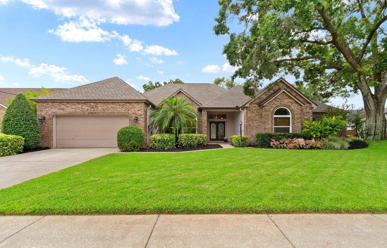 A VERY RARE FIND!!! Looking for a home with a LARGE WORKSHOP or RV GARAGE? You've found it! An updated 4bd/3ba home with a separate office/den, 4-CAR garage, NEW ROOF (2023), NEWER WINDOWS, Hardwood Flooring in all of the main living areas and office. The classically beautiful kitchen features solid wood cabinets, top tier granite countertops, newer stainless appliances, modern pendant lighting, a skylight to allow in natural light, and an updated stainless sink that overlooks the giant screened-in lanai, pool, jacuzzi, and large, beautifully landscaped, completely fenced-in backyard. The kitchen is open to the Great Room which features a vaulted ceiling and a stunning wood-burning fireplace! The extremely spacious Primary Suite has a grand tray ceiling and a pocket slider to the lanai, pool, and jacuzzi for late night soaking therapy. You will love the updated ensuite which features a large soaking tub, tiled walk-in shower, a large L-shaped, granite vanity with dual sinks, updated lighting, and a skylight that allows in natural sunlight and moonlight. The 3 secondary bedrooms are on the other side of the home. Two share a full jack-n-jill bathroom, and there's a hallway bathroom for the third bedroom and for guests. This bathroom also doubles as the pool bath with a french door to the enormous lanai, a perfect space for entertaining! Relax in the jacuzzi and watch the sunset in the West each evening! Out back, is the RV garage/workshop and humongous concrete slab that doubles as a RV parking spot, a dance floor, or a CORNHOLE competition space! Additional features include: whole house water softener system, reclaimed water for the yard irrigation, an indoor laundry room with a utility sink, 1/3 acre of property, and located on a cul-de-sac in a beautiful, upscale neighborhood with low HOA and No CDD. Dozens of restaurants, lots of shopping, and grocery stores within 5 minutes. 10 minutes to Brandon, and 30 minutes to Downtown Tampa. Close to I-75 and Interstate 4. Come tour this home before it's gone.
