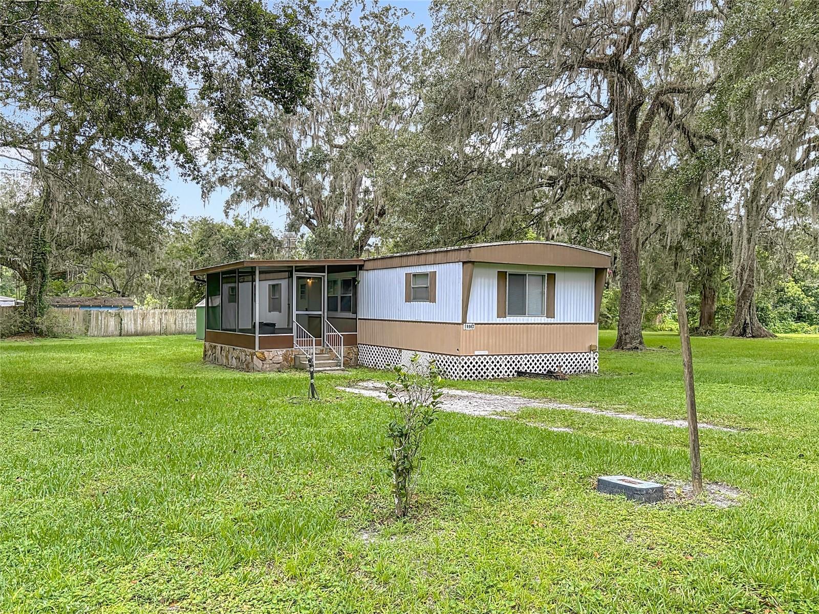This charming 2-bedroom, 2-bathroom 1981 manufactured home is situated on a spacious .40-acre lot at the end of Ruth St in the heart of Brooksville. Large screened in patio is ideal for enjoying Florida weather and the peacefulness of the location. With plenty of potential for expansion or even adding another unit, this property offers a great opportunity for customization to suit your preferences. The home is priced attractively, giving you the chance to make it your own with personal touches and updates. Additionally, the adjacent .90-acre lot at the end of Ruth St is also available for sale, providing even more potential for future development or expansion. Don't miss out on the opportunity to own a property in a desirable location with the flexibility to create your dream home or investment opportunity!