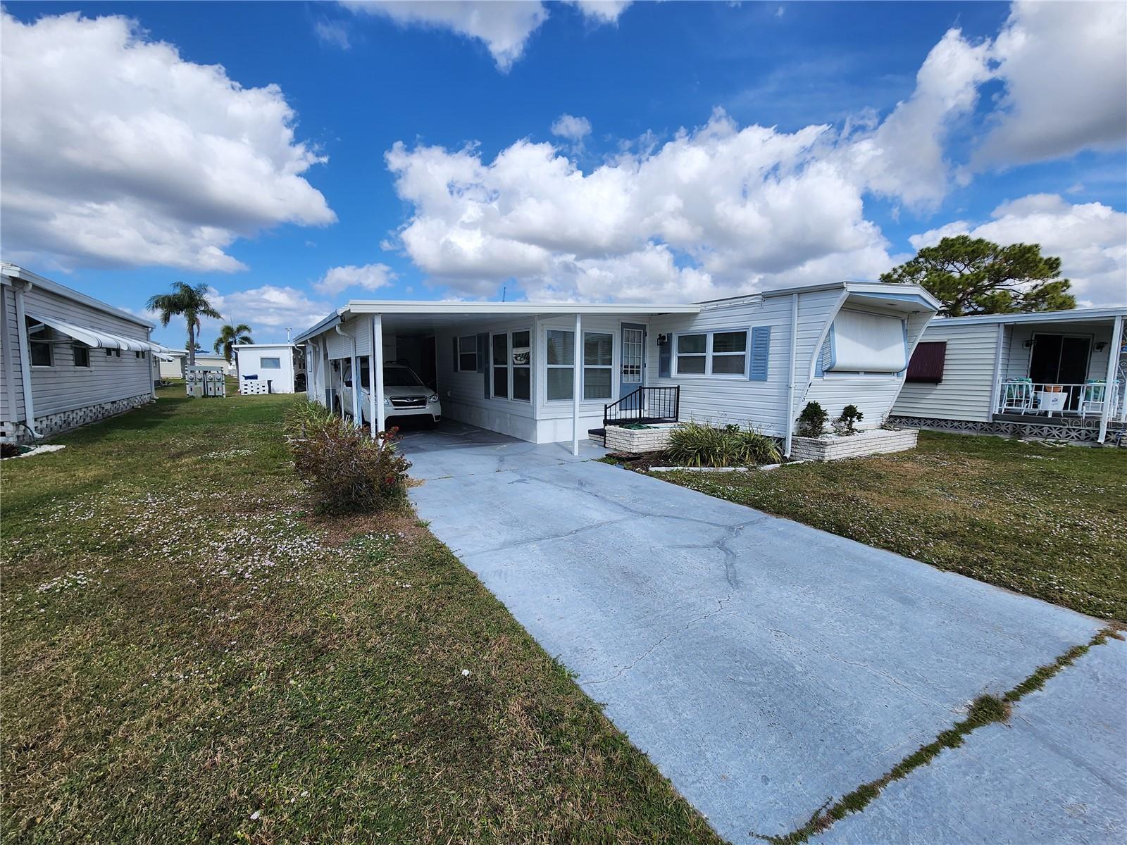 Motivated Seller!! Chateau Village is a vibrant 55+ activity community with NO LOT RENT and low maintenance fees. This charming two-bedroom, one-bath single-wide home, complete with an add-on, offers a comfortable and inviting living space. The roof was replaced in 2011, ensuring durability and peace of mind. Inside, the eat-in kitchen provides a cozy spot for meals and comes furnished for added convenience.
Ideally situated right across from the community pool, shuffleboard courts, and clubhouse, this home offers easy access to all the amenities Chateau Village has for you. For just $220 a month, residents enjoy a comprehensive package that includes water, sewer, trash, cable, internet, community management, lawn care, and access to the pool and shuffleboard facilities, making it truly a great community. Conveniently located near shopping, banks, restaurants, and the airport, this home is also just minutes away from the beaches. Whether you're looking for a seasonal retreat or a year-round residence, Chateau Village is the perfect place to call home.