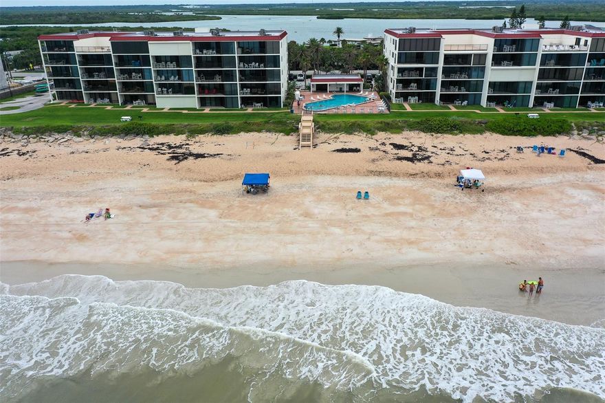 Direct oceanfront spacious 3 bedroom, 2 bath condo home.  Beautiful kitchen overlooks dining and living area to private oceanfront patio.  Professionally, beautifully decorated with newer upscale furniture.  This gated complex is located on the no drive southern peaceful and private section of New Smyrna Beach within walking distance to JB's Fish Camp.  Community pools and tennis courts.   Heavy duty floor to ceiling windows/sliders enhance the endless ocean views in both the master bedroom and living room.  With the 4th floor comes the surprise of an oceanfront balcony for the sunrises and a river view patio area for the ever changing sunsets.  Chadham Community offers lighted tennis courts, shuffleboard and 60x30 ocean front swimming pool.  Minutes to the Canaveral National Seashore.  Easy to see! ;LocationDescription: Condo ;Water: City