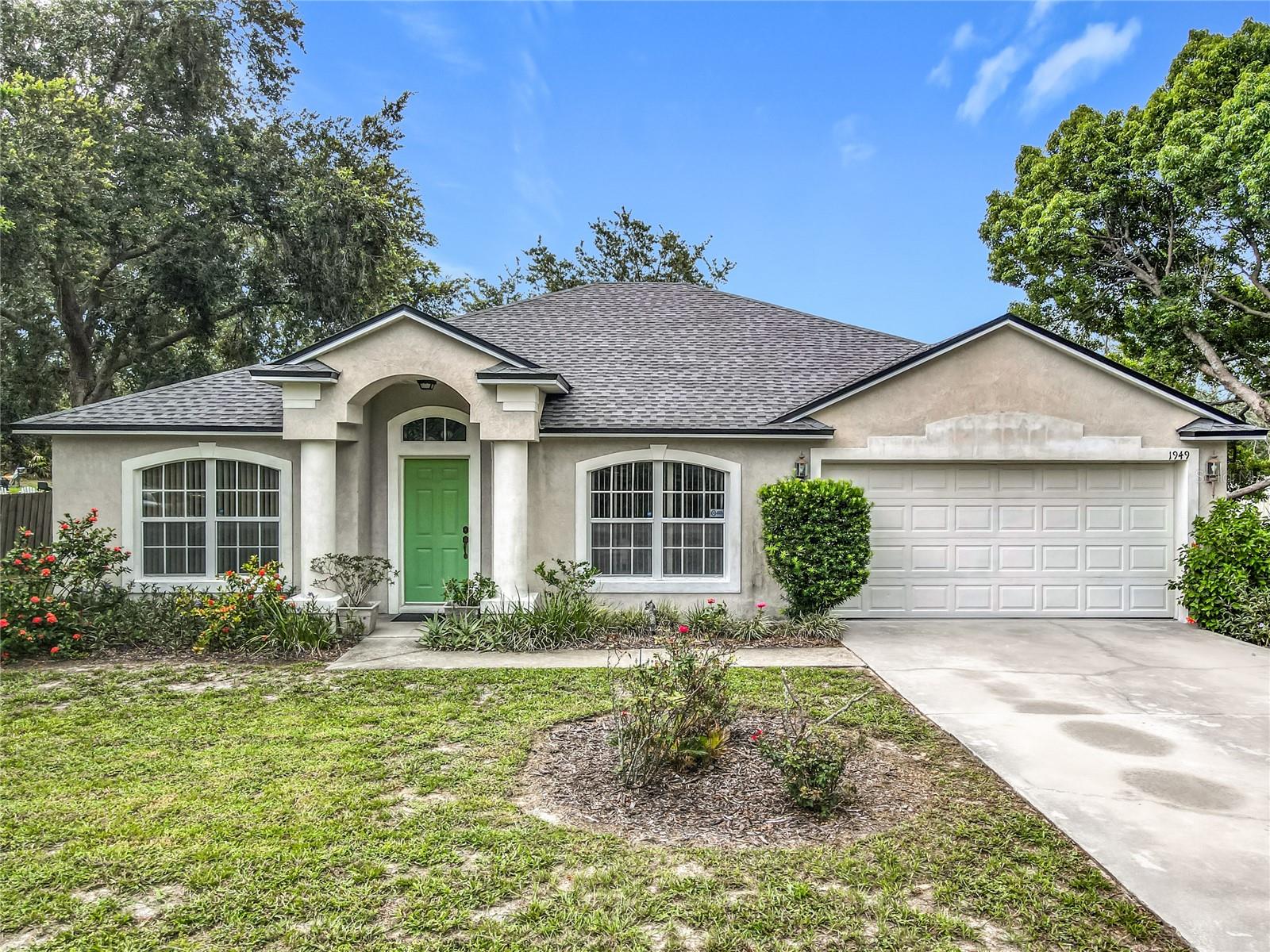 Soaring Ceilings...Super Private .23 of an acre Lot....Conveniently Located a little over a mile from the I-4 Exit!!!! **NEW ROOF 2023** Be the first to see this 3-bedroom, 2-bath home, with a bonus flex room that checks the box for having that one extra room...this flex room can be your private office, guest bedroom, or a play room; this 11' x 11' room has a beautiful glass French door entry. This home feels so BIG because of the 15 foot cathedral ceilings & the open split-plan floor plan. The primary bedroom has vaulted ceilings and measures 18' x 11'. The spacious primary bathroom has a big soaking tub/shower, a double sink vanity, and a walk in closet. The Kitchen has so much room, measuring 17' x 13', and you have a lot of cabinet storage & counter top space for days. The stainless steel appliances sparkle and are newer (except for the fridge.) The open kitchen and family room combination makes for easy entertaining and provides room for the whole family!!! The other side of the home has 2 secondary bedrooms, a guest bathroom, and a convenient laundry room. You'll love the screened in lanai with a real shingle roof over top, not a flimsy metal roof. Enjoy the morning sunrise with coffee, and wine down in the evenings free from the mosquitos. All appliances are included (washer & Dryer as well.) You will enjoy how private this lot feels, the backyard feel like it is a private park. Be the first to see and call for your private showing.