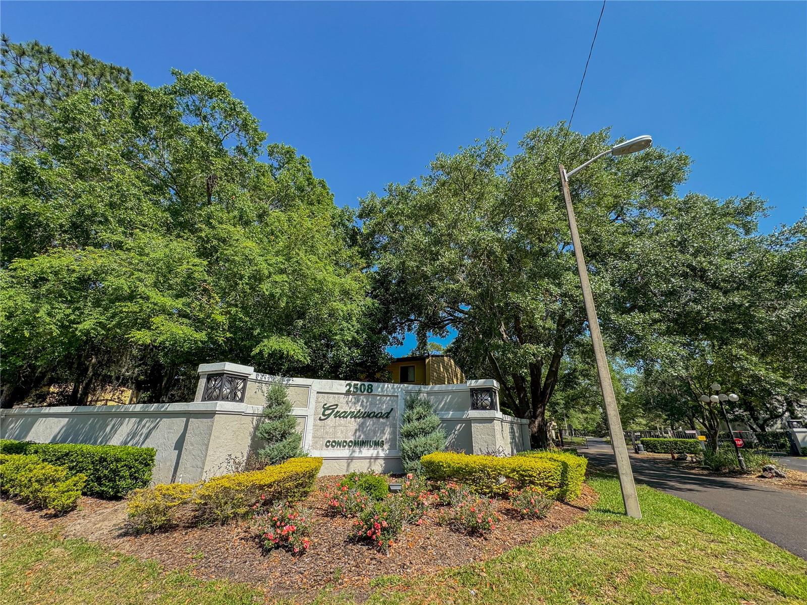 OCCUPIED THROUGH AUGUST 15th, 2024. Welcome to this expansive 2 bed/2.5 bath condominium nestled within a secure GATED community, strategically positioned for easy access to the University of Florida and Shands Hospital. Situated in a serene wooded and well-manicured community, this two-story layout provides added privacy, with no neighbors above or below. Step inside the open concept floor plan to discover a ergonomic kitchen with upgraded appliances, real wood cabinets, quartz countertops, elevated breakfast bar, and a convenient pantry closet. You then enter a spacious living/dining room combo complemented by simulated wood flooring throughout downstairs. Adjacent to the living room area, a large screened-in porch awaits, perfect for unwinding after a busy day, with an attached storage closet for convenience. Upstairs has two large bedrooms. Each bedroom has an attached full bathroom, ensuring comfort and privacy for all occupants. The main bedroom has "his and hers" walk-in closets, offering ample storage space. This unit stands out as larger than typical 2-bedroom condos in Gainesville that are under 1000 sq feet - this unit is over 1,400 sq feet! Moreover, it's the only gated condo community along the bus route to UF, making it a sought-after choice for medical residents and students of the medical, dental, and veterinary schools. Outside the gate, a UF campus/Shands bus stop awaits. Or just hop in the car as it's only a 5-7 minute drive to UF. The commute is seamless and this one is priced to sell! OCCUPIED THROUGH AUGUST 15th, 2024.