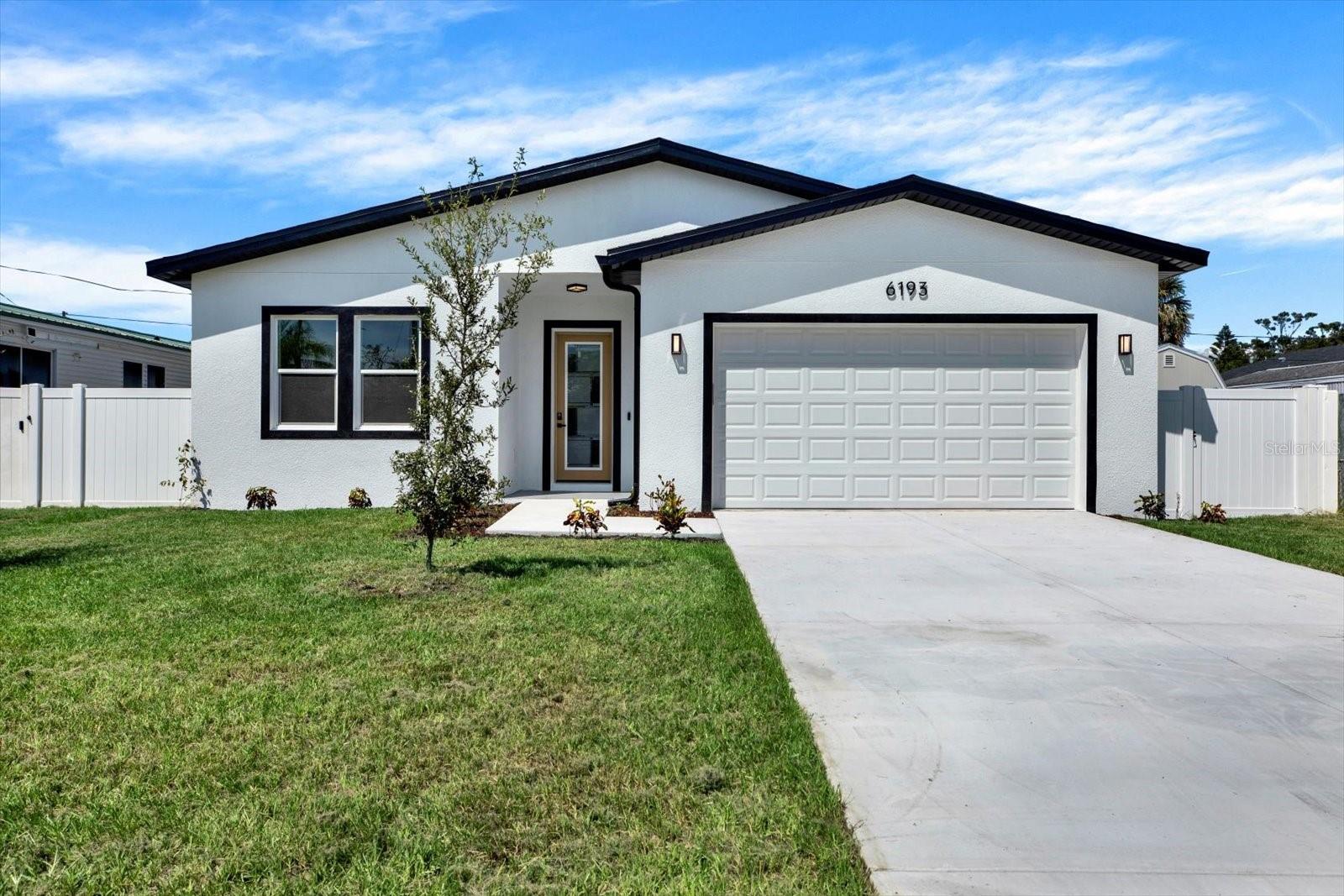 One or more photo(s) has been virtually staged. Step into luxury with this brand-new 2025 block-construction modern home, perfectly situated in a non-flood zone. Featuring 3 bedrooms, 2 bathrooms, and a spacious 2-car garage, this home combines style, comfort, and peace of mind. From the moment you enter, soaring 10-foot ceilings and an open-concept layout fill the space with natural light, creating an airy and welcoming atmosphere.
The kitchen is a true centerpiece, boasting sleek stone countertops, stainless steel appliances, a spacious pantry, and a seamless flow into the dining and living areas, making it perfect for entertaining or everyday living. Extend your lifestyle outdoors on the covered back patio, ideal for relaxing evenings or weekend gatherings.
Nestled on a quiet dead-end street, the property offers privacy and minimal traffic while maintaining a central location just minutes from Clearwater, Downtown St. Petersburg, Tampa, shopping, dining, and entertainment.
Every detail has been carefully designed for style, comfort, and functionality so you can move in worry-free. Don’t miss your chance. Schedule your showing today.