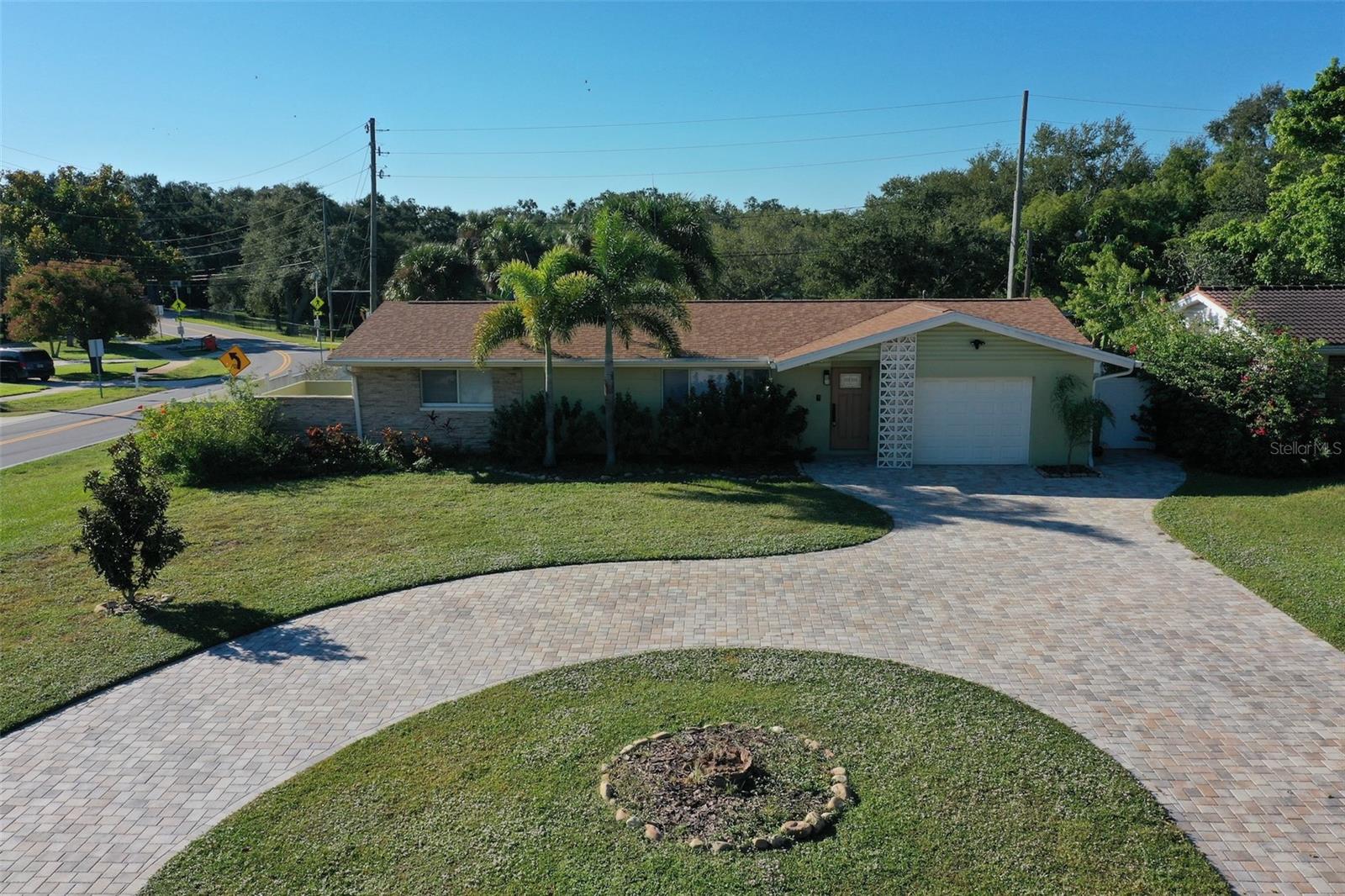 FULLY RENOVATED “FOUNTAIN HOME” AT SEMINOLE CITY PARK. Move right in to this beautifully updated unfurnished 2-bedroom, 2-bath home on a large corner lot, offering unobstructed fountain/lake views and direct access to peaceful Seminole City Park and Pinellas Trail, giving you the rare combination of privacy, nature, and convenience.
This home is located in the highly rated Seminole School District, just 3 minutes from Seminole City Center and 8 minutes from Redington Shores beach. Enjoy peace of mind as it’s also in a NON-FLOOD and NON-EVACUATION zone.
Inside, this open concept home features a bright, open layout with stylish modern updates throughout. The spacious kitchen is equipped with quartz countertops, stainless steel appliances, and updated flooring, making it perfect for cooking and entertaining.
The kitchen is a cook’s dream, with a spacious island, quartz countertops and a full suite of stainless Samsung appliances. Both bathrooms have been tastefully remodeled, and fresh interior paint complements the home’s warm, inviting feel. Additional features include a 5 year old roof, 8 year old A/C system, newer windows, full size washer/dryer, and a one-car garage with custom built-in storage. The paver circular driveway adds convenience and curb appeal, while the reclaimed water sprinkler system keeps the yard lush with minimal maintenance.
Enjoy the perfect blend of comfort, convenience, and beautiful lakefront living in one of Seminole’s most desirable locations!