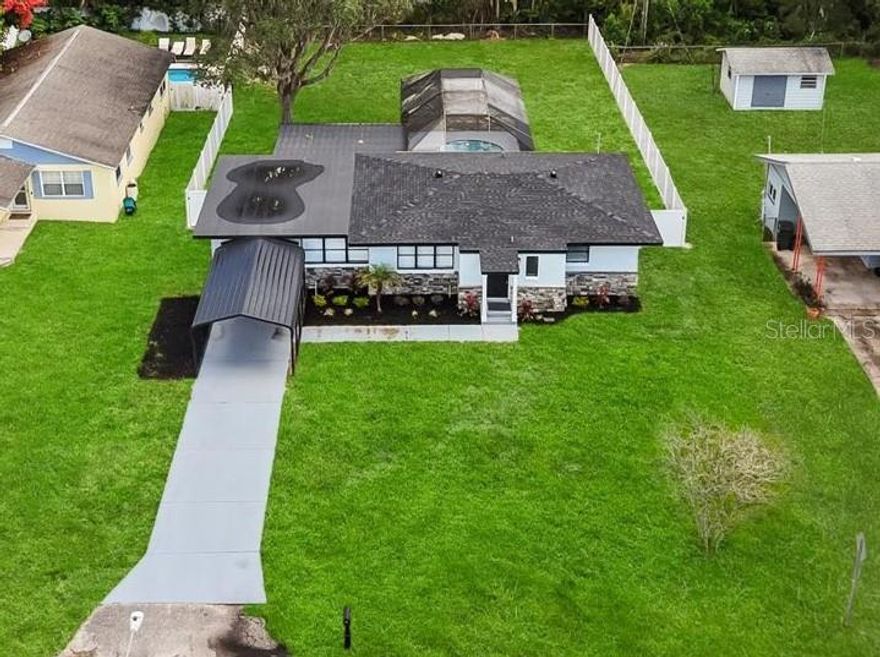 Stunning renovation with designer finishes through out! Situated on an extra-large, 13,125 sq ft lot. Beautiful stone entry; 3 bed/2 bath with a split floor plan. New wht shaker cabinets with 'Luna Pearl' granite in kitchen & baths w/ under mount sinks; All NEW Samsung gourmet blk stainless steel appliances; Huge breakfast bar with TONS of cabinetry; GORGEOUS stone electric fire place- can be turned on w/ or w/o heat at the touch of a remote! All new vinyl plank flooring thru-out entire home (no carpet); All new faucets, fixtures, fans & LED lighting; New 3 tone paint inside and out; Master bedroom has His/Hers closet; Master bath has custom, two-person, walk-in stone shower; BRAND NEW Roof, Updated AC & Electrical panel; Backyard is absolute paradise! GIANT 400 sq ft screened-in, carpeted back patio; Sparkling, newly renovated pool with fully screened-in enclosure; New landscape, flowers, mulch, sprinklers. Secluded backyard; Fully fenced in for pets and privacy. No HOA... this home has it all!