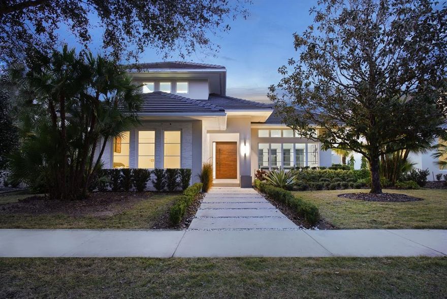 Built by Barcellona Homes, this two-story residence offers sleek, modern finishes among more than 3,700 square feet. Embracing a transitional style, the four-bedroom, four-full-and-one-half-bathroom home was designed with careful thought to family and private spaces, including an outdoor living area that creates an ideal ambiance of exclusivity and enjoyment. The formal dining room, living room and sitting area feature white polished porcelain floors that stretch throughout the first floor. The open-concept kitchen features Bosch and Sub-Zero appliances, charcoal quartz countertops and a large eat-in center island that overlooks the family room. Multiple sets of sliding glass doors open from the family room, kitchen and living room to the outdoor living area. The courtyard includes a large wooden deck, summer kitchen, sparkling pool and spa and ample space for entertaining. The second floor of the home encompasses three additional en suite bedrooms with walk-in closets. The owner’s suite, occupying the left-wing of the second level, overlooks the pool. The owner’s bathroom contains a glass, double rain shower, a free-standing tub and a generous walk-in closet with custom built-in storage. Additional features include a pool bath, mud room, and a three-car garage.