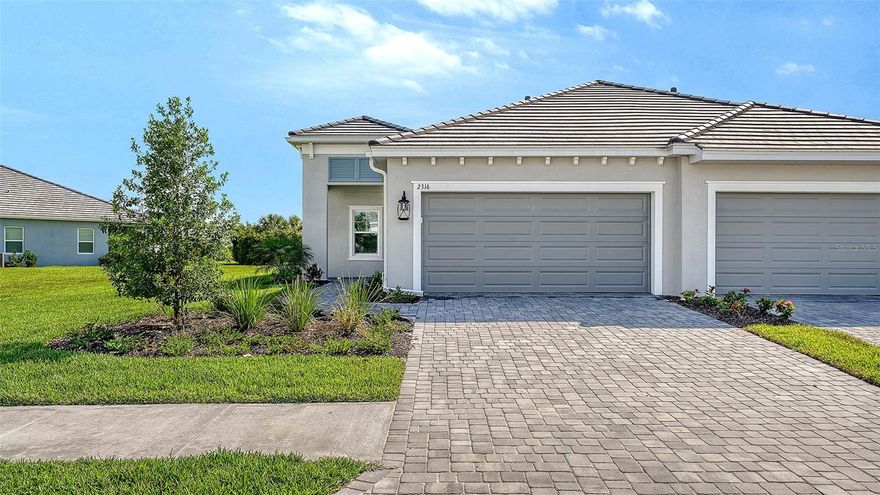 The Tidewater 2B twin villa by Neal Communities offers two bedrooms, two baths, and a spacious open layout designed for comfortable living. The main living area seamlessly connects the great room, dining space, and kitchen with an island, creating an inviting setting for gathering and entertaining. A private den adds flexibility for a home office, hobby room, or additional living space. The covered lanai provides a comfortable outdoor area for relaxing or enjoying fresh air. Inside, tile and wood flooring enhance the home’s stylish appeal, complemented by a neutral color palette that creates a timeless and cohesive design throughout. The owner’s suite features dual closets and a well-appointed bath with double vanities, a walk-in shower, and private water closet. A secondary bedroom with a walk-in closet and nearby full bath provides comfort and convenience for guests or family members.