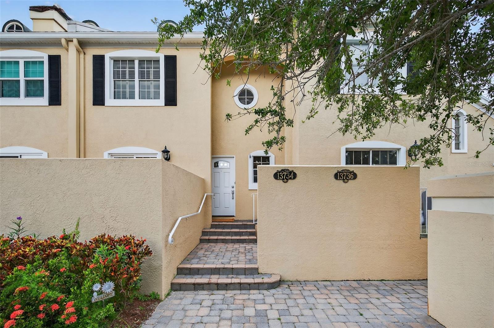 One or more photo(s) has been virtually staged. Welcome Home to this remarkable property located in the subdivision of Lakepointe Villas, (Clearwater, FI). Located in the Golf/Tennis Community of Feather Sound.Feather Sound Country Club(Membership fees required).Across the Street from the Feather Sound Country Club.This exquisite 2-bedroom, 2.5-bathroom , 1665 SQ. ft, with a lower maintenance fee of $430.00. Reserves are fully funded. The HOA has approved new roofs to start in Oct./Nov. of 2025 for the main residential bldgs. The Home boasts an abundance of character and warmth. Conveniently situated just a short 25-minutes drive from the renowned Gulf Beaches, it offers a truly unbeatable location. Finding a home that encompasses such a wide array of amenities and charm, like this one in Clearwater, FL, can be quite challenging. As you approach the property, you will be greeted by the oversized green space, complemented by a circular driveway and a magnificent Oak trees, providing a majestic first impression.Inside, the home features an open style layout creating a perfect balance between an open concept design, ideal for entertaining and family gatherings, and individual spaces for family members. The two bedrooms are generously proportioned, with the primary bedroom having ensuite bathroom for added convenience. The yard ensures privacy while still providing ample space to enjoy the generous yard and the inviting green space. Additionally, this home is conveniently located within minutes of excellent dining options, Morton Plant Hospital, and a mere 2O-minute drive from the St. Pete / Clearwater Airport, as well as 30 minutes from Tampa International Airport. You will find that it strikes the perfect balance of accessibility and seclusion. With a in AC system installed in 2023, and meticulous updates and maintenance, this home is truly move-in ready. Don't miss this incredible opportunity to call this house your home.