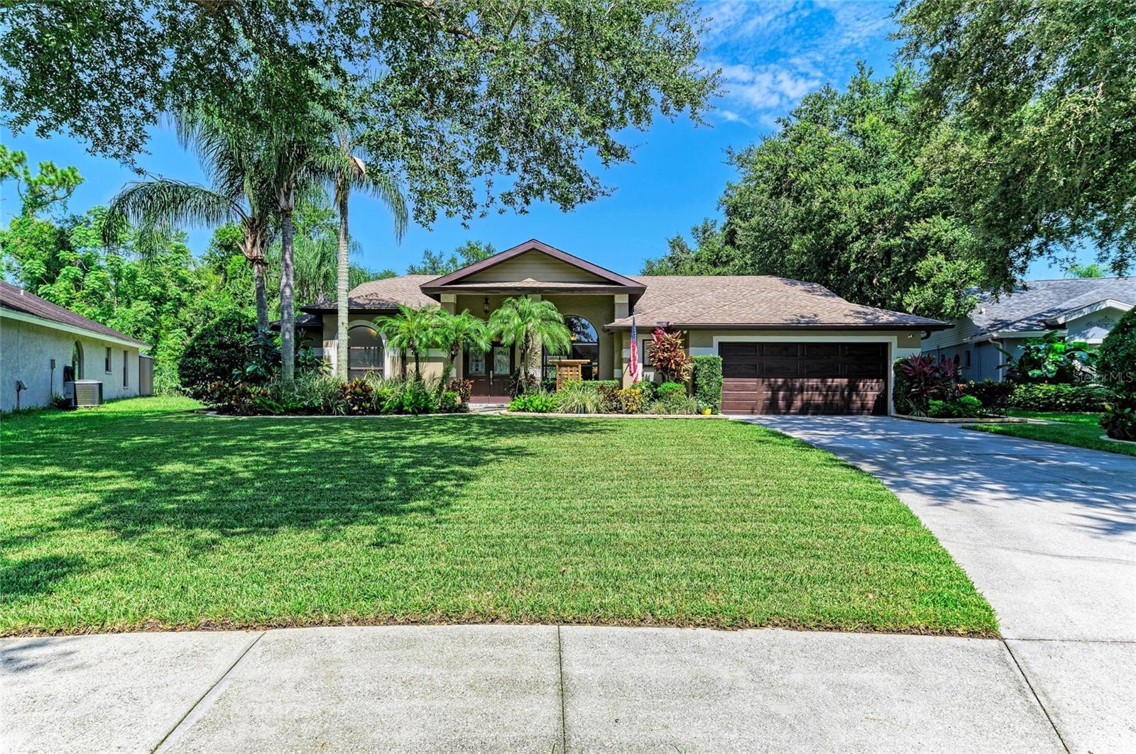 If you are looking for a home that has been completely remodeled, on a quite cul-de-sac, near everything Sarasota has to offer, then you have found the ONE! This home has undergone an extensive remodel within the last couple years. This kitchen was designed with entertainment in mind with a quartz island that is OVER 8 FEET SQUARE! The custom kitchen has plenty of solid wood cabinets, custom drawer inserts and quartz countertops. Kitchen Aide stainless steel appliances. The family room includes an 11+ foot long custom built-in and can house up to an 85 inch tv. The primary bedroom is quite the retreat with a custom pocket door to separate the sleeping area from the ensuite and walk-in closet. The walk-in closet has been custom built with matching sides for his and hers with a shoe rack on both sides for all of your shoes and boots. There is also plenty of storage in the drawers for your jewelry and clothes along with a 8 foot full length mirror to check out your finished look. The ensuite includes a walk in shower for ease and comfort. The guest bathroom has been customized with a walk in shower, sliding glass door, new vanity with matching quartz top, along with some live-edge shelving. The home has had the popcorn ceiling removed, recessed lighting added a few choice light fixtures were added as well. As you step outside you will need to decide where you are going to entertain. The under truss area is large and has a custom tongue and groove stained plank ceiling for your ambiance while sitting around the firepit or enjoying dinner at the table. The T.V. mount allows you to be sitting at the custom built-in table in the pool enjoying your favorite drink while watching your team win! If grilling is your thing then this home does not disappoint. Enjoy the outdoor "GRILLZEEBO" for your grilling needs then have a seat at the outdoor fire pit. Enjoy sitting around the fire with your friends and your favorite drink after a long day swimming in the heated oversized pool. Lots of time and thought went into the lovely landscaping to provide the quintessential Florida vibe. Low voltage lighting provides evening ambiance and lights the way on the lovely paver path from the front of the home to the rear. There is a custom feel to this house with all the outdoor wood projects that make this home one of a kind.